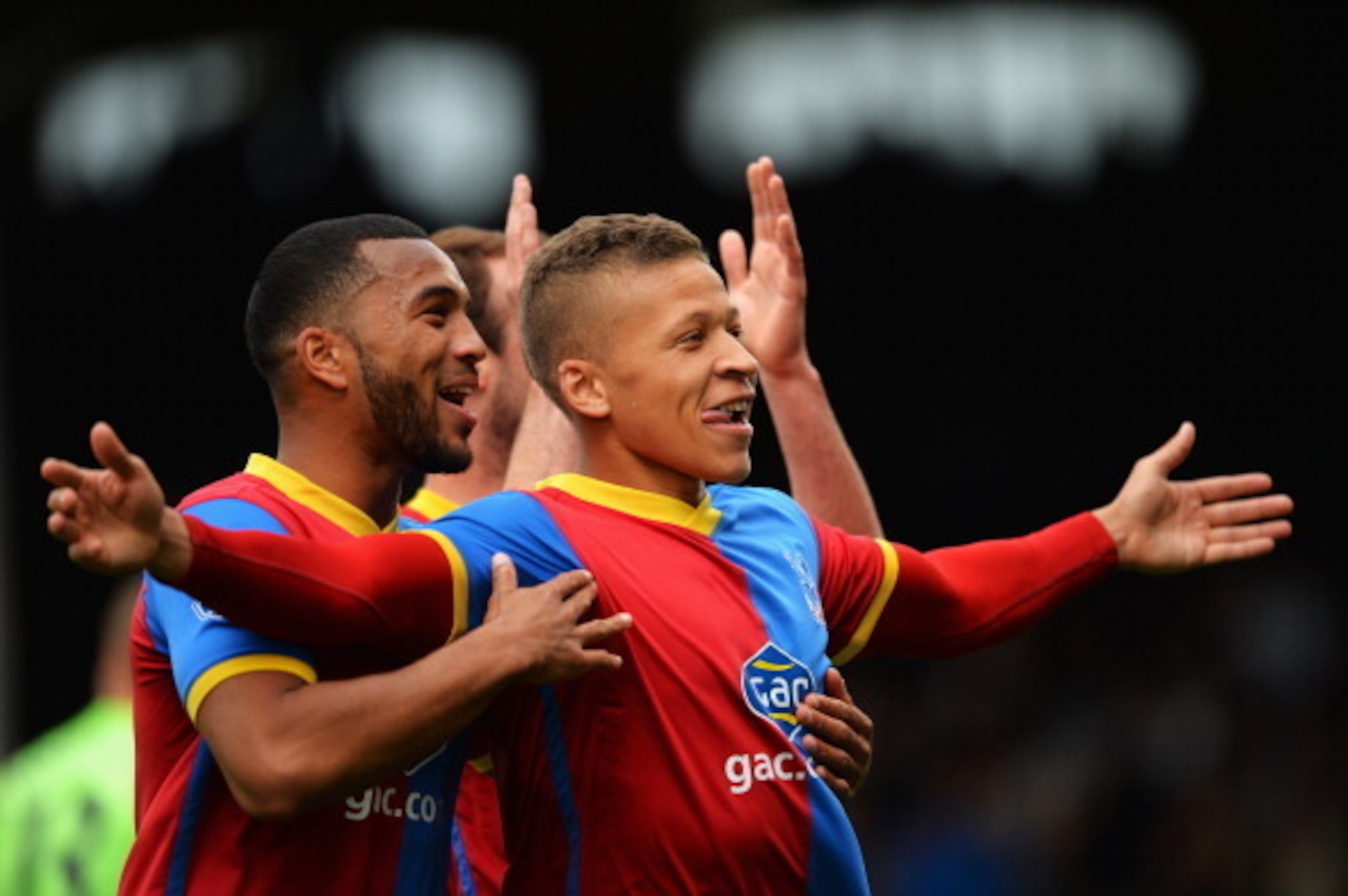 LONDON, ENGLAND - MAY 11:  Dwight Gayle (R) of Crystal Palace celebrates scoring his second goal during the Barclays Premier League match between Fulham and Crystal Palace at Craven Cottage on May 11, 2014 in London, England.  (Photo by Christopher Lee/Ge