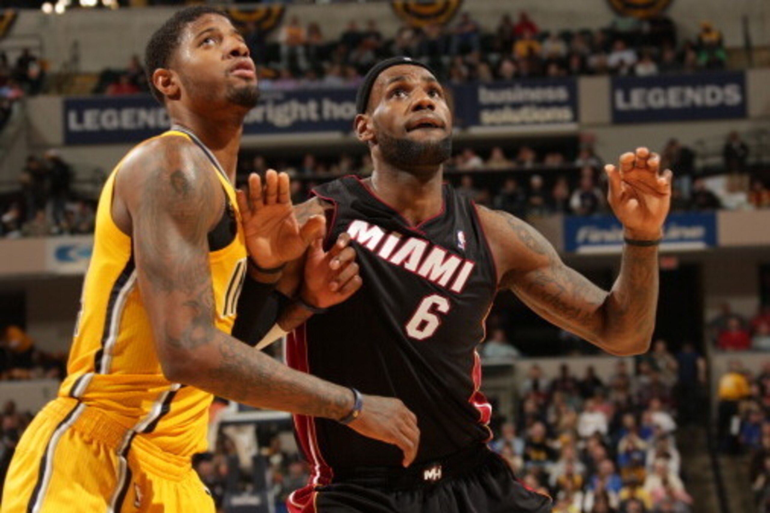 INDIANAPOLIS - MARCH 26: LeBron James #6 of the Miami Heat boxes out Paul George #24 of the Indiana Pacers during the game at Bankers Life Fieldhouse on March 26, 2014 in Indianapolis, Indiana.  NOTE TO USER: User expressly acknowledges and agrees that, b