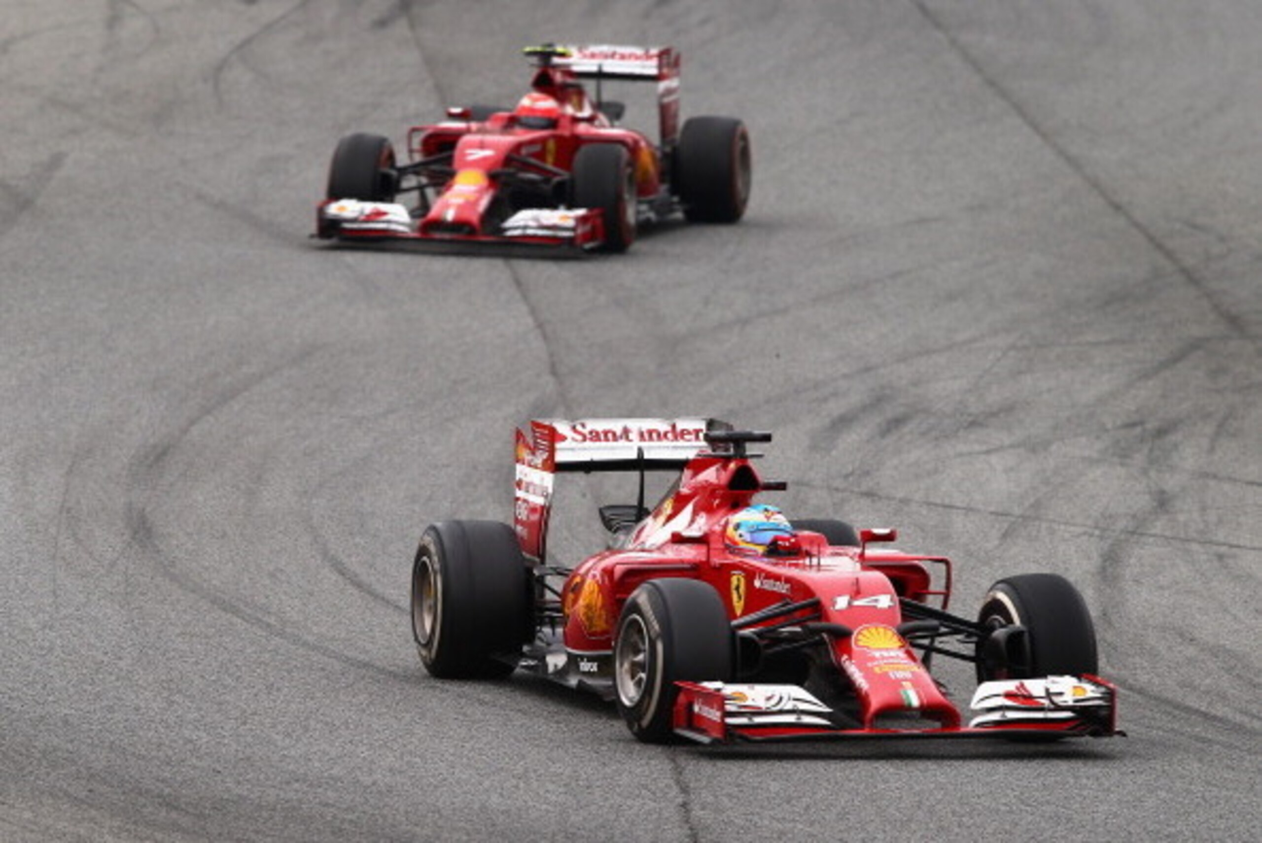 MONTMELO, SPAIN - MAY 11:  Fernando Alonso of Spain and Ferrari leads Kimi Raikkonen of Finland and Ferrari during the Spanish Formula One Grand Prix at Circuit de Catalunya on May 11, 2014 in Montmelo, Spain.  (Photo by Clive Mason/Getty Images)
