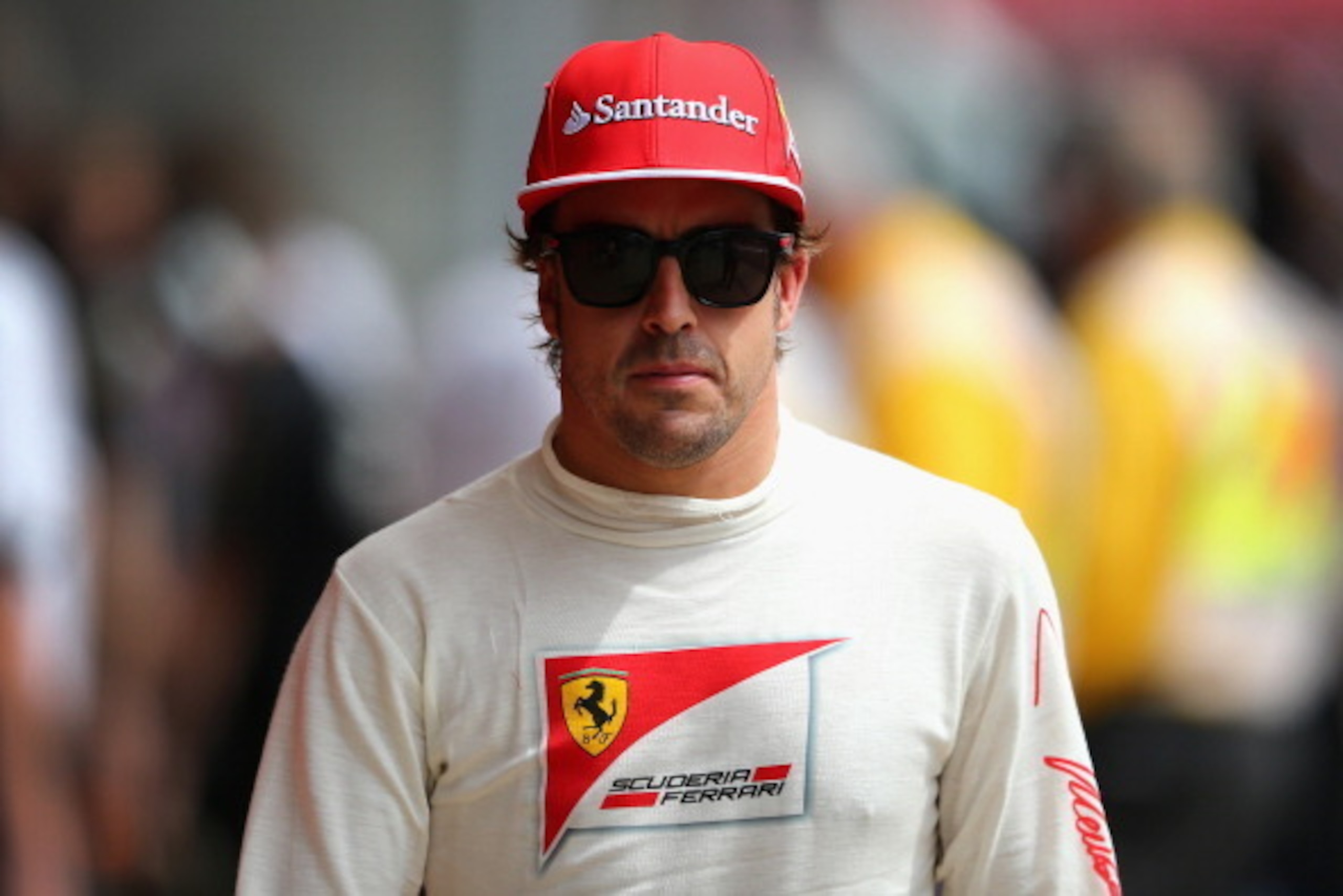 MONTMELO, SPAIN - MAY 10:  Fernando Alonso of Spain and Ferrari looks on in the paddock during final practice ahead of the Spanish F1 Grand Prix at Circuit de Catalunya on May 10, 2014 in Montmelo, Spain.  (Photo by Clive Mason/Getty Images)