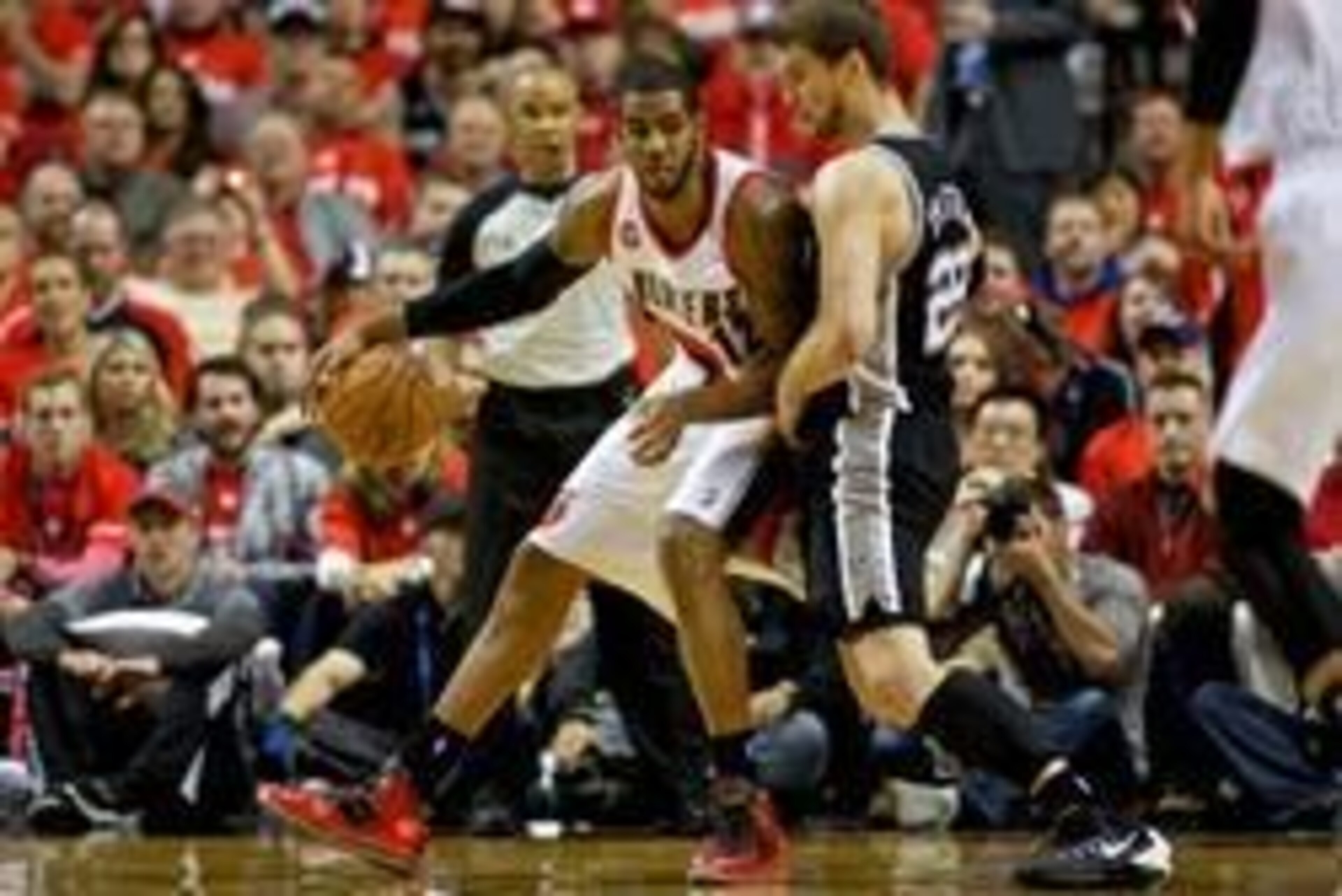 May 10, 2014; Portland, OR, USA; Portland Trail Blazers forward LaMarcus Aldridge (12) defends San Antonio Spurs center Tiago Splitter (22) in game three of the second round of the 2014 NBA Playoffs at the Moda Center. Mandatory Credit: Craig Mitchelldyer