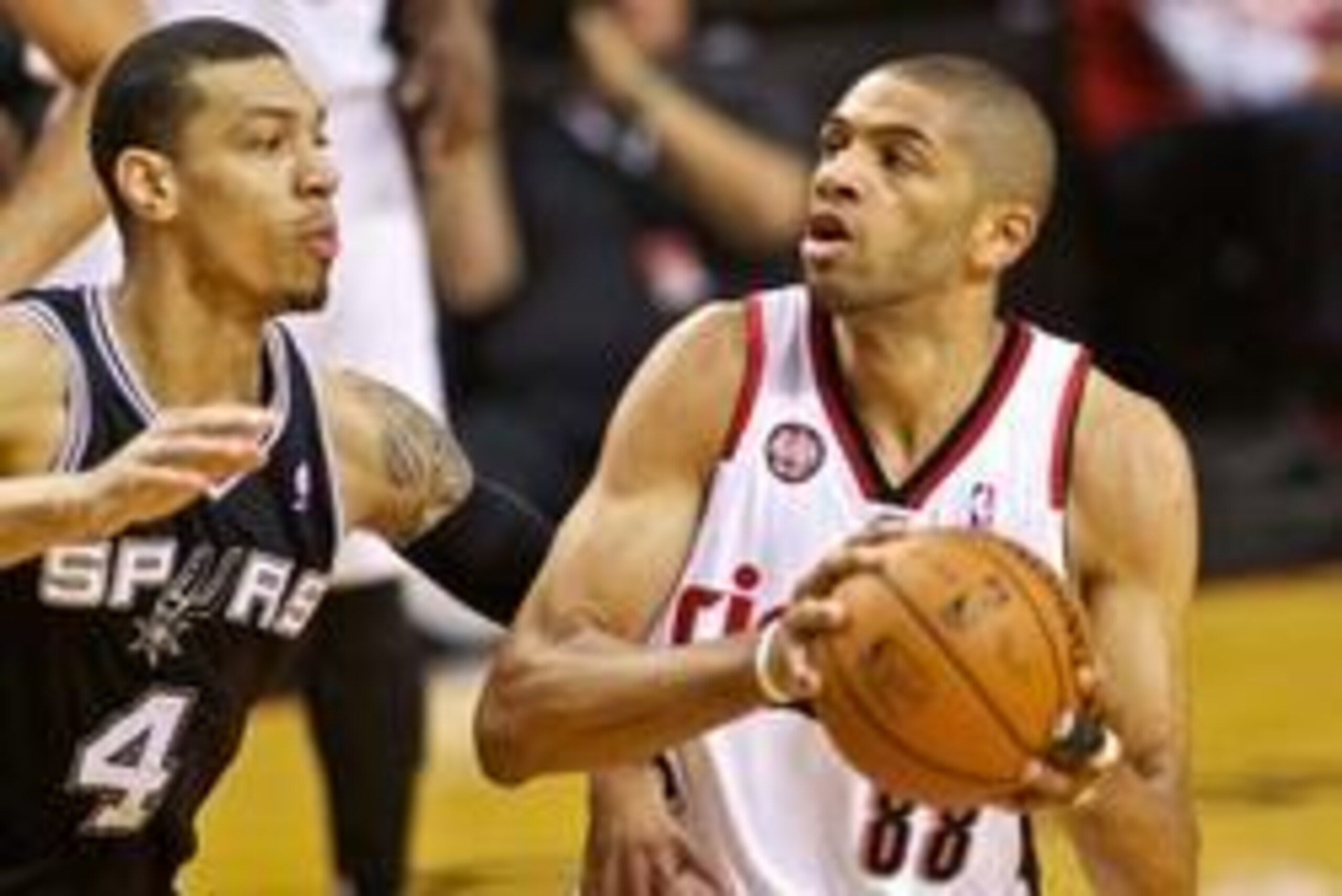 May 12, 2014; Portland, OR, USA; Portland Trail Blazers forward Nicolas Batum (88) drives past San Antonio Spurs guard Danny Green (4) during the first quarter in game four of the second round of the 2014 NBA Playoffs at the Moda Center. Mandatory Credit: