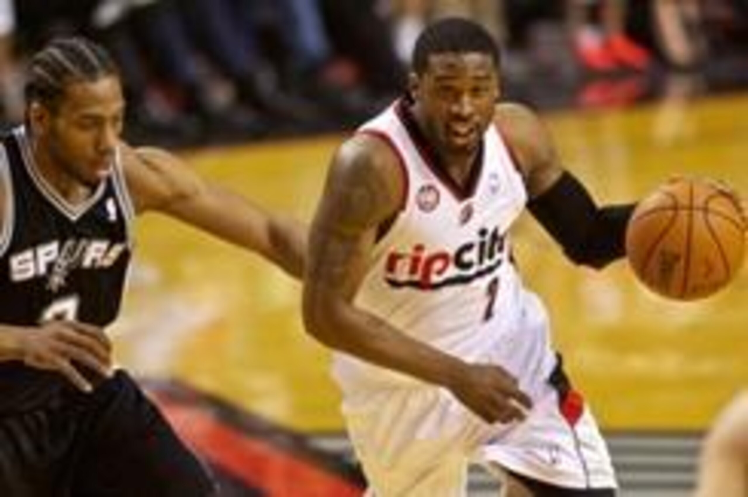 May 12, 2014; Portland, OR, USA; Portland Trail Blazers guard Wesley Matthews (2) drives past San Antonio Spurs forward Kawhi Leonard (2) during the first quarter in game four of the second round of the 2014 NBA Playoffs at the Moda Center. Mandatory Cred