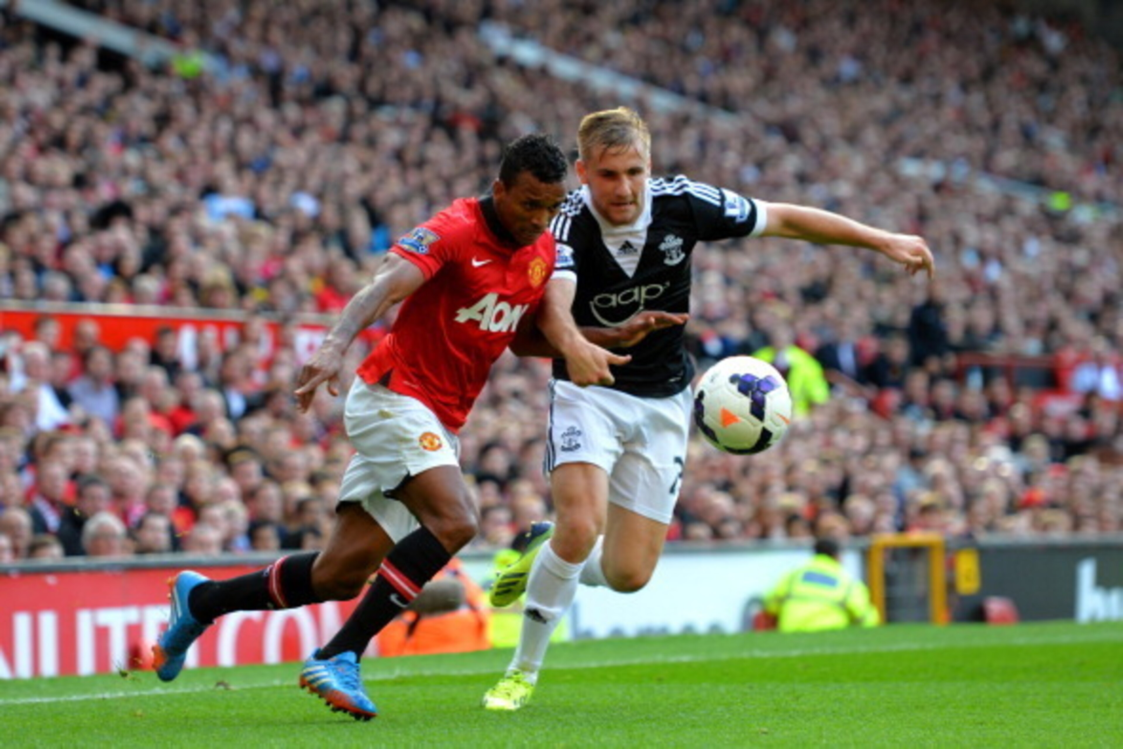 MANCHESTER, ENGLAND - OCTOBER 19: Nani of Manchester United is challenged by Luke Shaw of Southampton during the Barclays Premier League match between Manchester United and Southampton at Old Trafford on October 19, 2013 in Manchester, England. (Photo b MANCHESTER, ENGLAND - OCTOBER 19: Nani of Manchester United is challenged by Luke Shaw of Southampton during the Barclays Premier League match between Manchester United and Southampton at Old Trafford on October 19, 2013 in Manchester, England. (Photo b