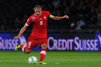 BERN, SWITZERLAND - OCTOBER 15:  Gokhan Inler of Switzerland in action during the FIFA 2014 World Cup Qualifier match between Switzerland and Slovenia match held at Stade de Suisse on October 15, 2013 in Bern, Switzerland.  (Photo by Harold Cunningham/Get
