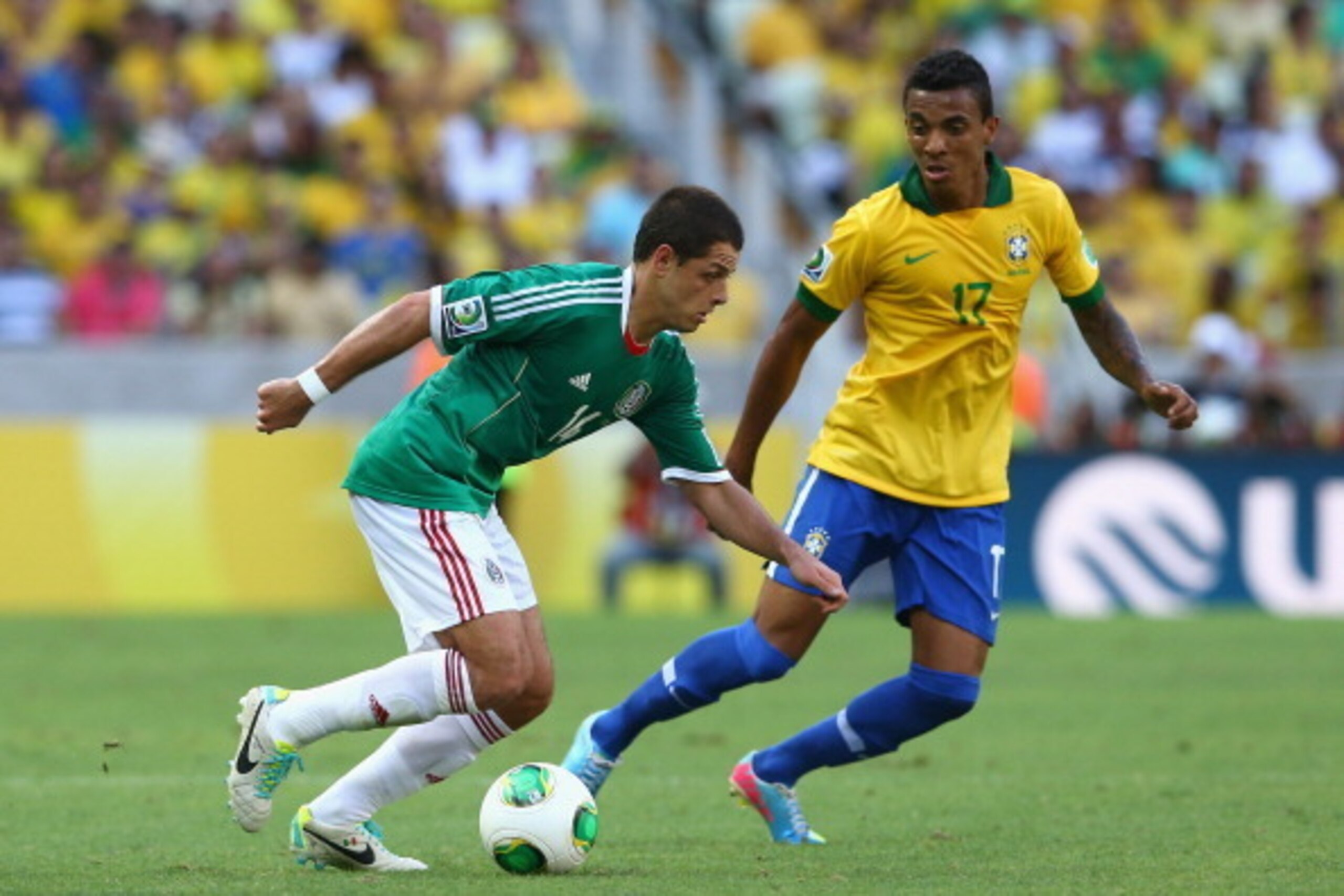 FORTALEZA, BRAZIL - JUNE 19:  Javier Hernandez of Mexico competes with Luiz Gustavo of Brazil during the FIFA Confederations Cup Brazil 2013 Group A match between Brazil and Mexico at Castelao on June 19, 2013 in Fortaleza, Brazil.  (Photo by Robert Cianf