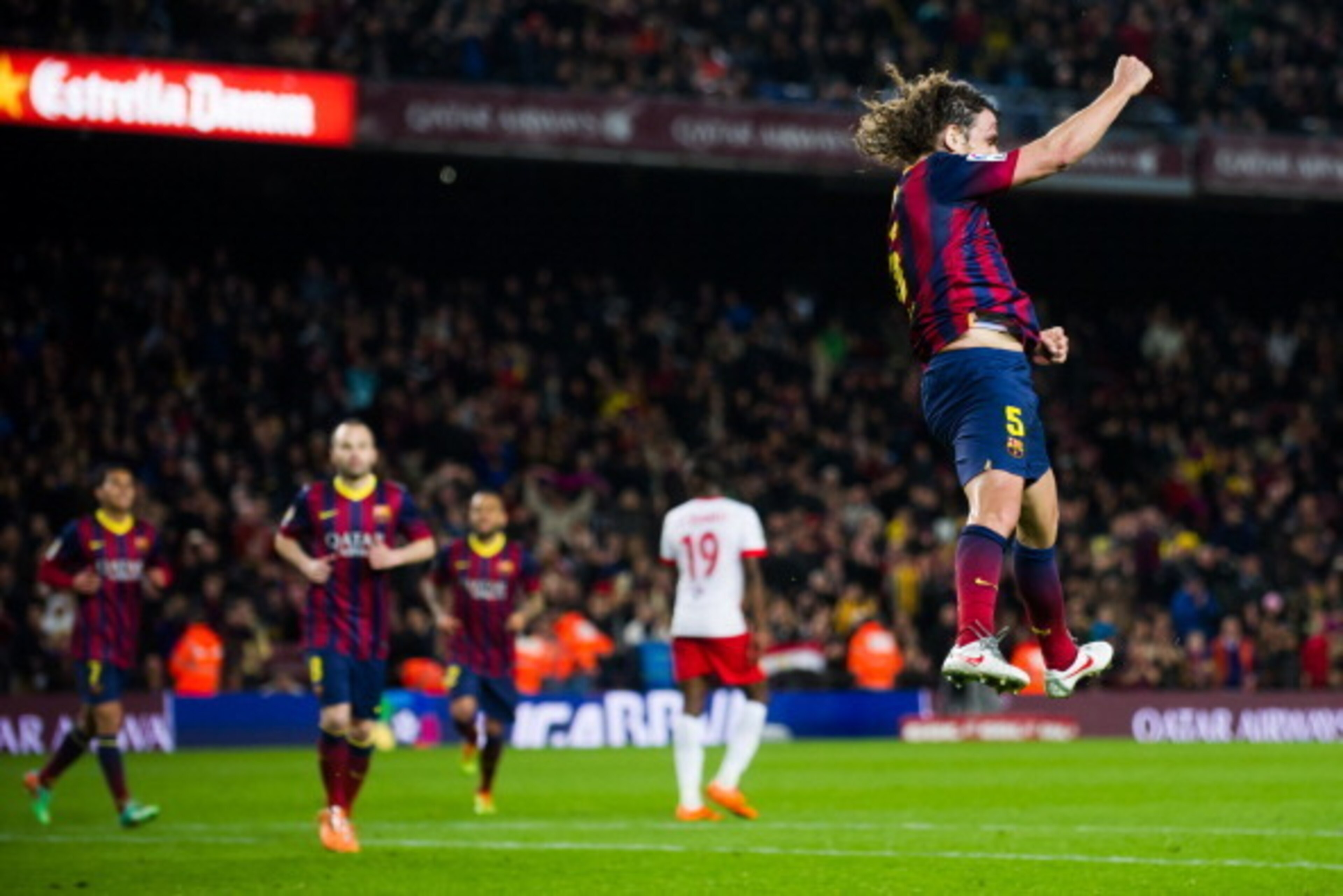 BARCELONA, SPAIN - MARCH 02: Carles Puyol celebrates after scoring his team's third goal during the La Liga match between FC Barcelona and UD Almeria at Camp Nou on March 2, 2014 in Barcelona, Spain.  (Photo by Alex Caparros/Getty Images)