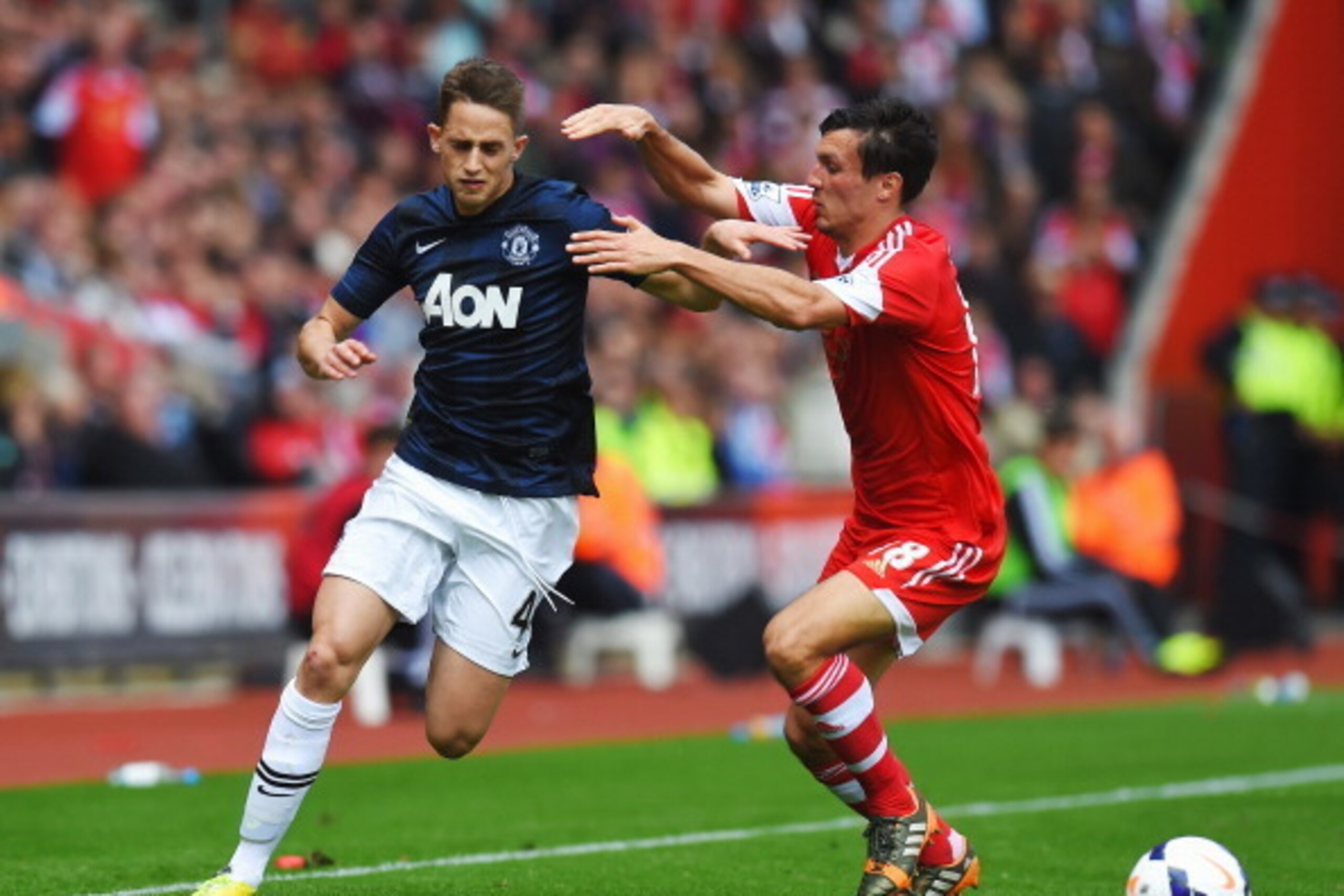 SOUTHAMPTON, ENGLAND - MAY 11:  (L-R) Adnan Januzaj of Manchester United is challenged by Jack Cork of Southampton during the Barclays Premier League match between Southampton and Manchester United at St Mary's Stadium on May 11, 2014 in Southampton, Engl