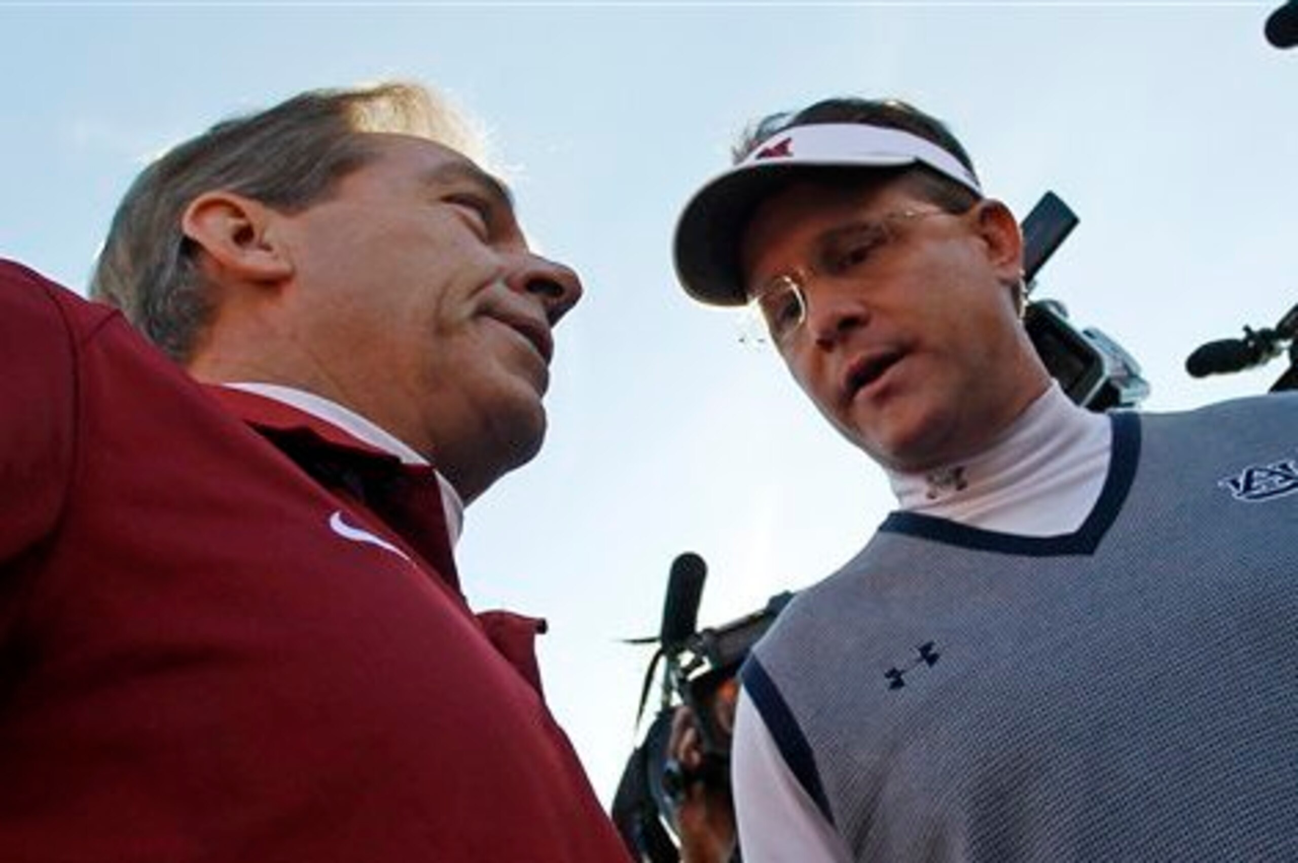Alabama head coach Nick Saban (left) and Auburn head coach Gus Malzahn
