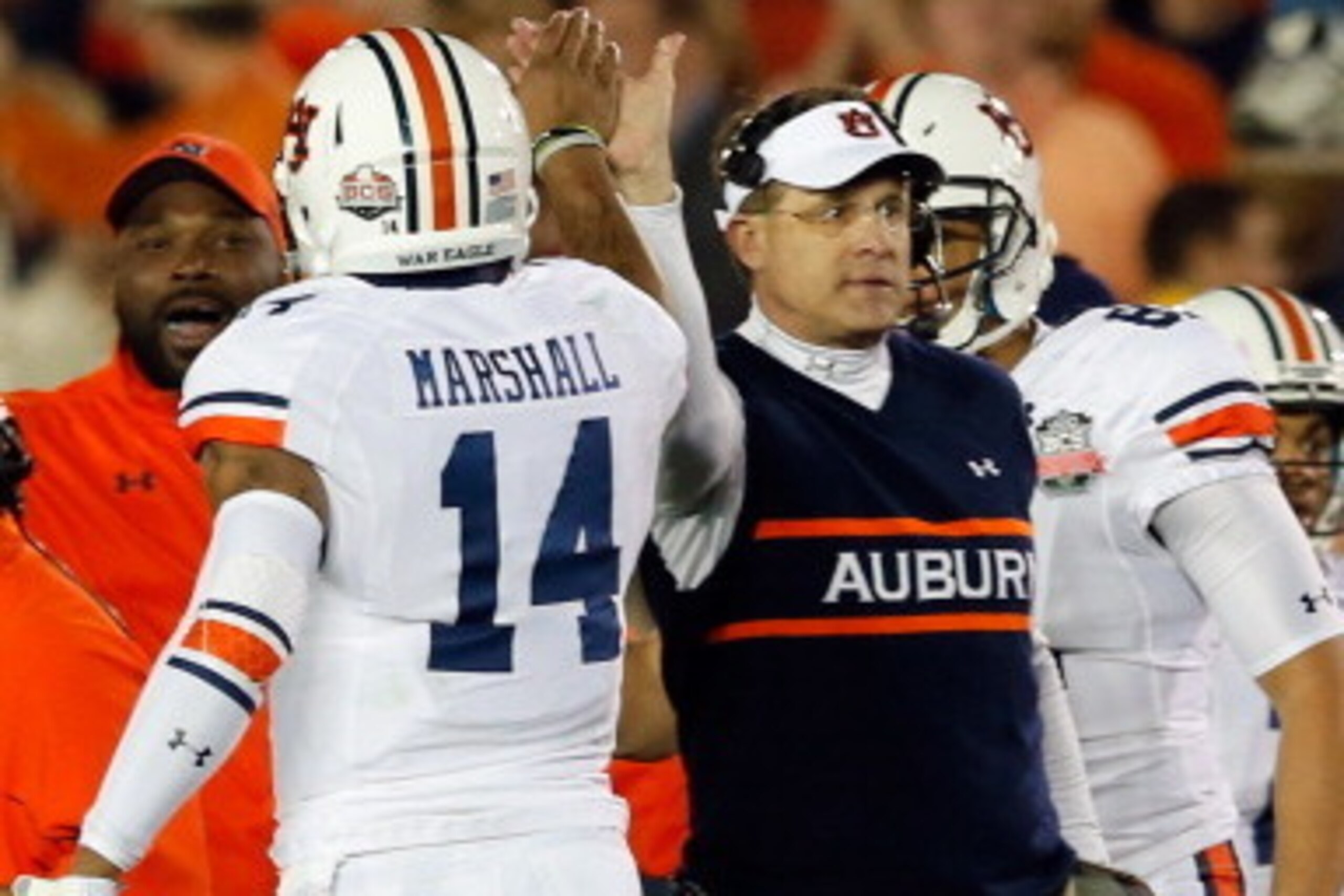 PASADENA, CA - JANUARY 06:  Quarterback Nick Marshall #14 and head coach Gus Malzahn celebrate after a touchdown against the Florida State Seminoles in the second quarter of the 2014 Vizio BCS National Championship Game at the Rose Bowl on January 6, 2014