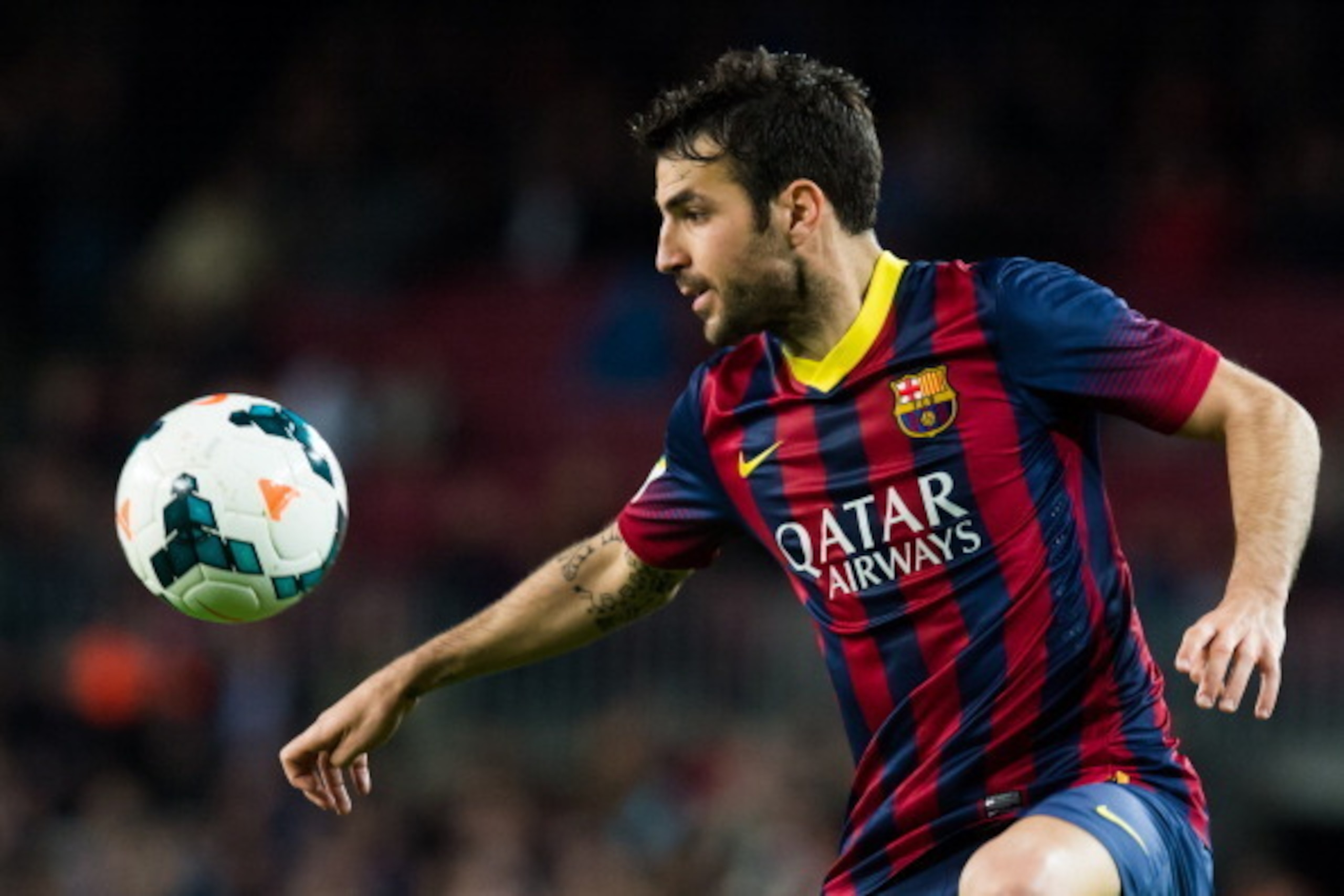 BARCELONA, SPAIN - MARCH 26: Cesc Fabregas of FC Barcelona controls the ball during the La Liga match between FC Barcelona and RC Celta de Vigo at Camp Nou on March 26, 2014 in Barcelona, Spain. (Photo by Alex Caparros/Getty Images)