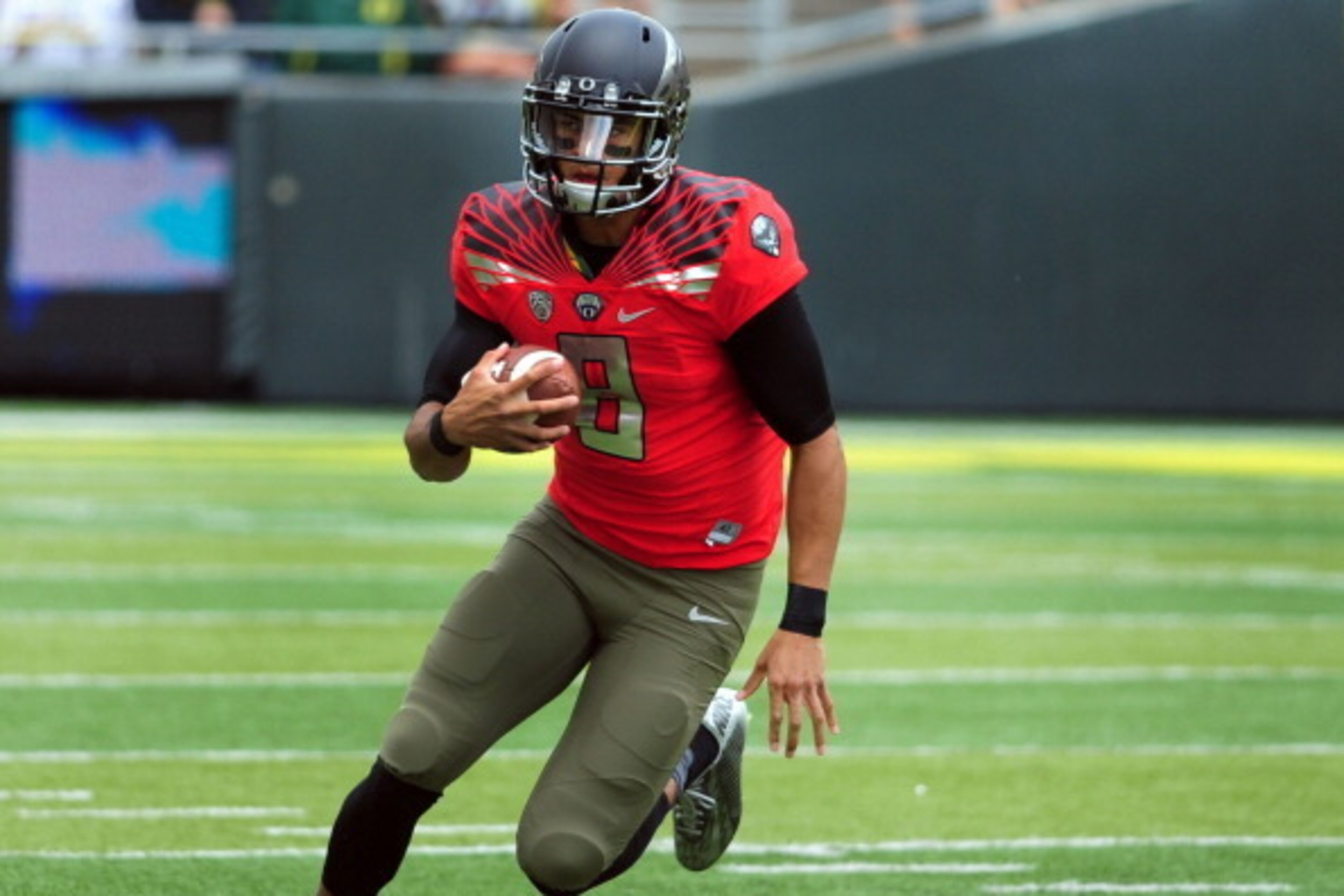 EUGENE, OR - MAY 3: Quarterback Marcus Mariota #8 of the Oregon Ducks runs with the ball during the spring game at Autzen Stadium on May 3, 2014 in Eugene, Oregon. (Photo by Steve Dykes/Getty Images)