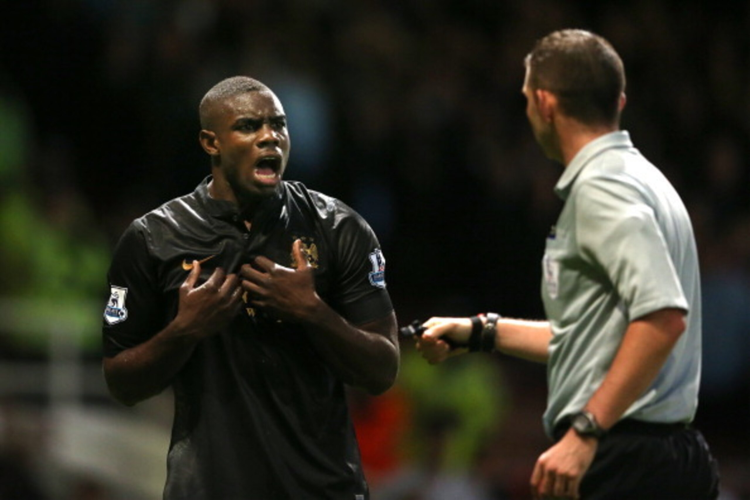 LONDON, ENGLAND - OCTOBER 19:  Micah Richards of Manchester City remonstrates with Referee Michael Oliver during the Barclays Premier League match between West Ham United and Manchester City at Boleyn Ground on October 19, 2013 in London, England.  (Photo