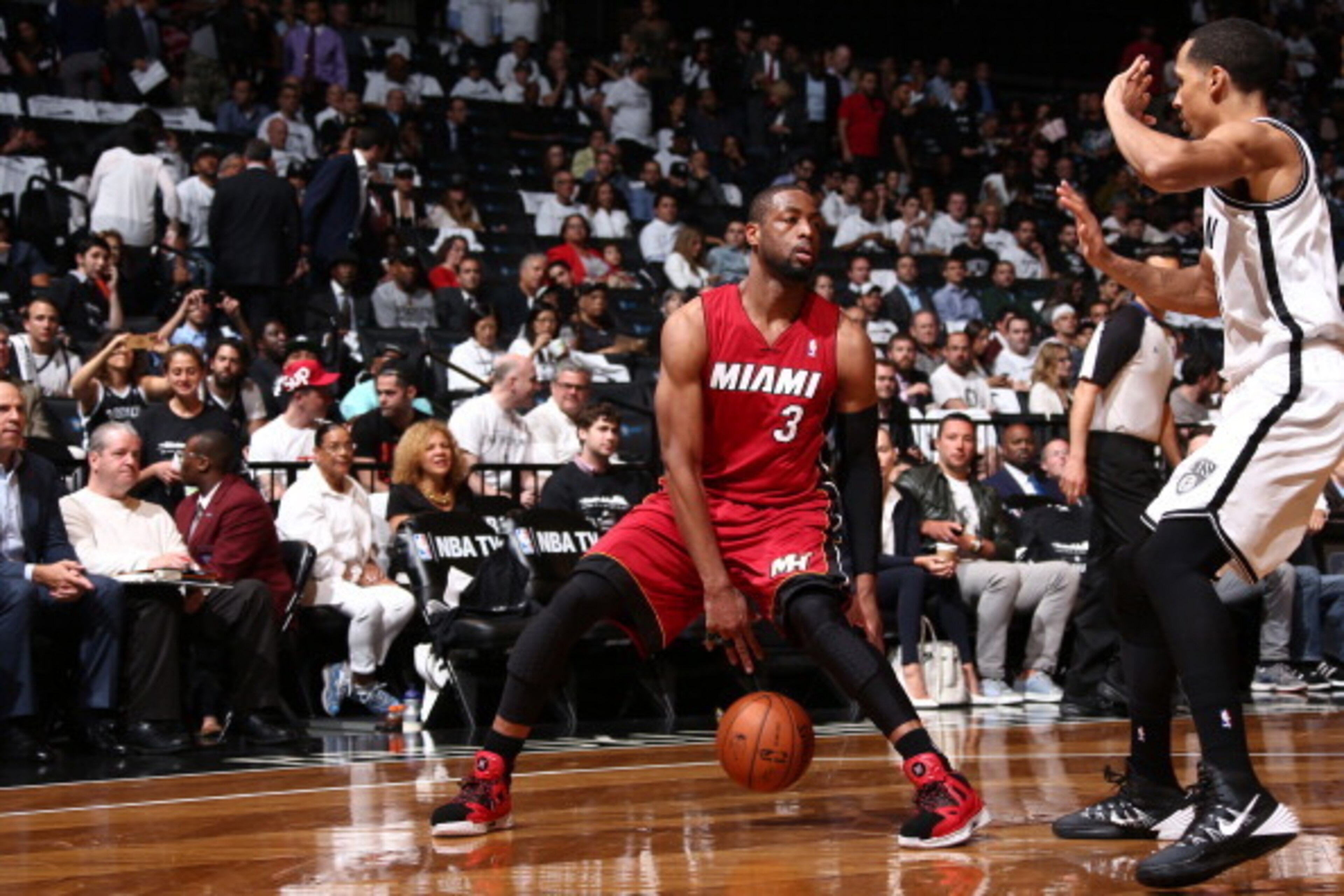 BROOKLYN, NY - MAY 12: Dwyane Wade #3 of the Miami Heat handles the ball against the Brooklyn Nets in Game Four of the Eastern Conference Semifinals during the 2014 NBA Playoffs on May 12, 2014 at Barclays Center in Brooklyn. NOTE TO USER: User expressly BROOKLYN, NY - MAY 12: Dwyane Wade #3 of the Miami Heat handles the ball against the Brooklyn Nets in Game Four of the Eastern Conference Semifinals during the 2014 NBA Playoffs on May 12, 2014 at Barclays Center in Brooklyn. NOTE TO USER: User expressly