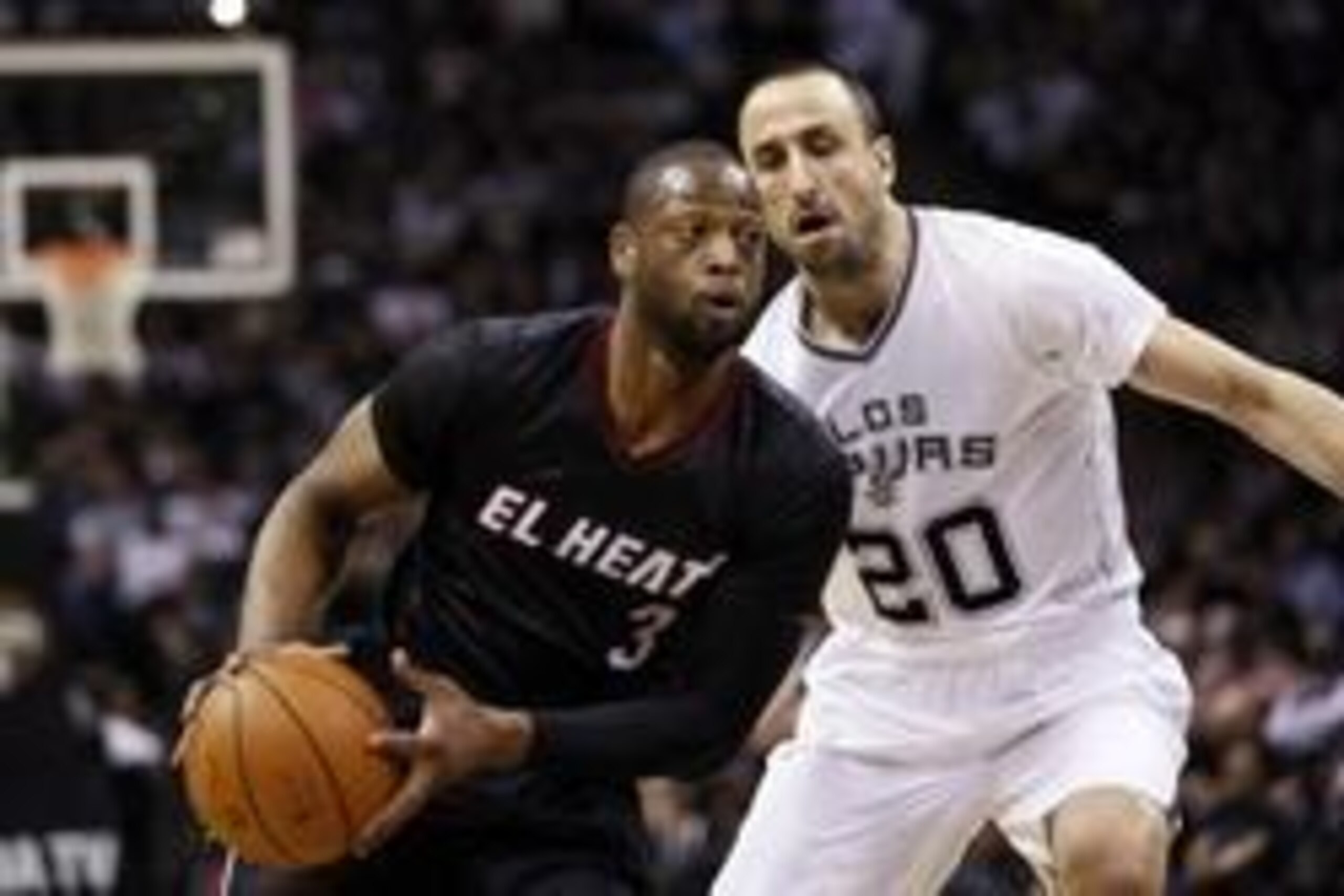 Mar 6, 2014; San Antonio, TX, USA; Miami Heat guard Dwyane Wade (3) drives to the basket past San Antonio Spurs guard Manu Ginobili (20) during the first half at AT&T Center. Mandatory Credit: Soobum Im-USA TODAY Sports