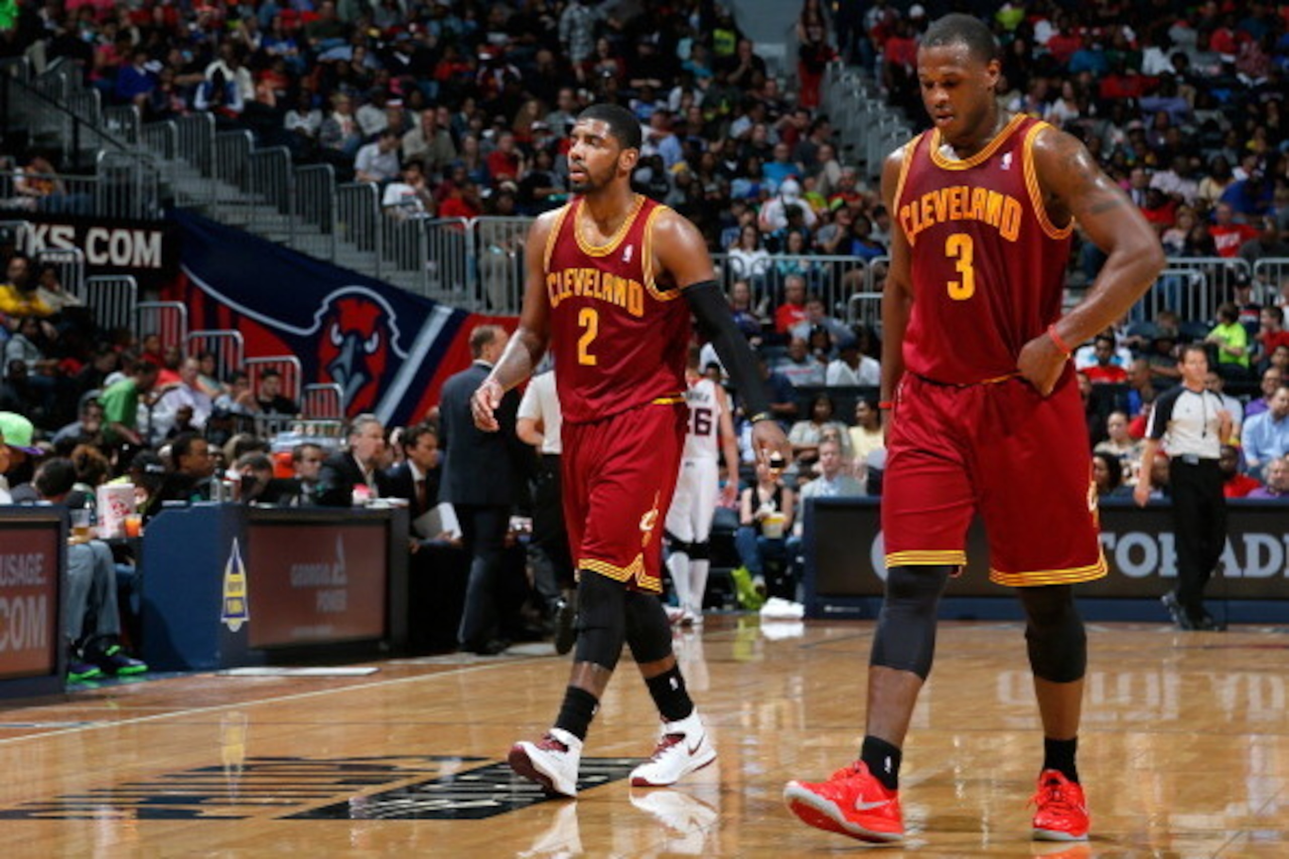 ATLANTA, GA - APRIL 04:  Kyrie Irving #2 and Dion Waiters #3 of the Cleveland Cavaliers walk off the court between free throws in their 117-98 loss to the Atlanta Hawks at Philips Arena on April 4, 2014 in Atlanta, Georgia.  NOTE TO USER: User expressly a
