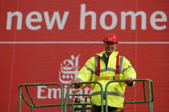 LONDON - OCTOBER 5:  Manager Arsene Wenger of Arsenal poses outside Arsenal Football Club's new Emirates Stadium development at Ashburton Grove on October 5, 2004 in London.  Arsenal have just announced the stadium will be called the Emirates Stadium for 