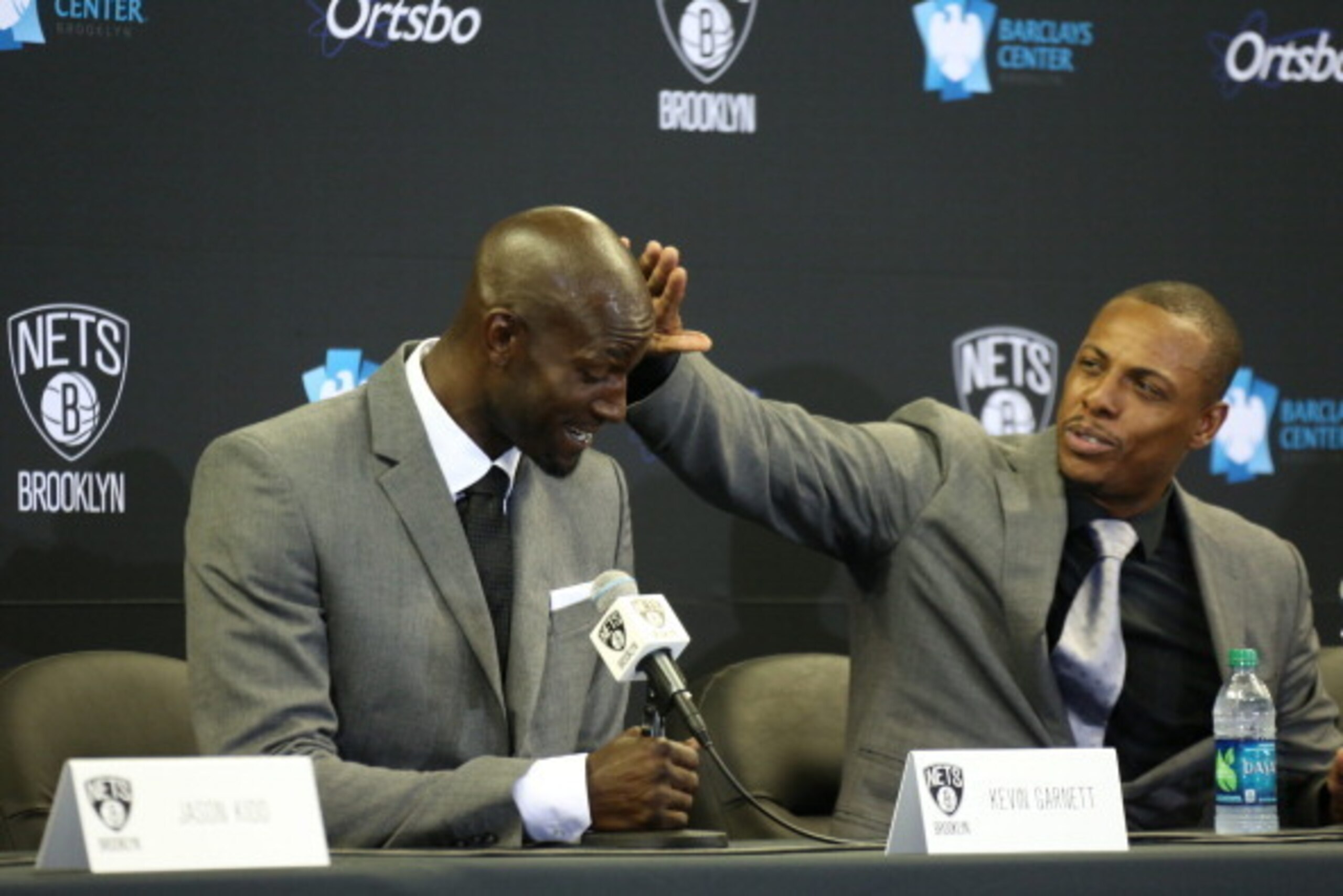 BROOKLYN, NY - July 18: Paul Pierce #34 and Kevin Garnett #2 of the Brooklyn Nets interact during a press conference at the Barclays Center on July 18, 2013 in the Brooklyn borough of New York City.  NOTE TO USER: User expressly acknowledges and agrees th