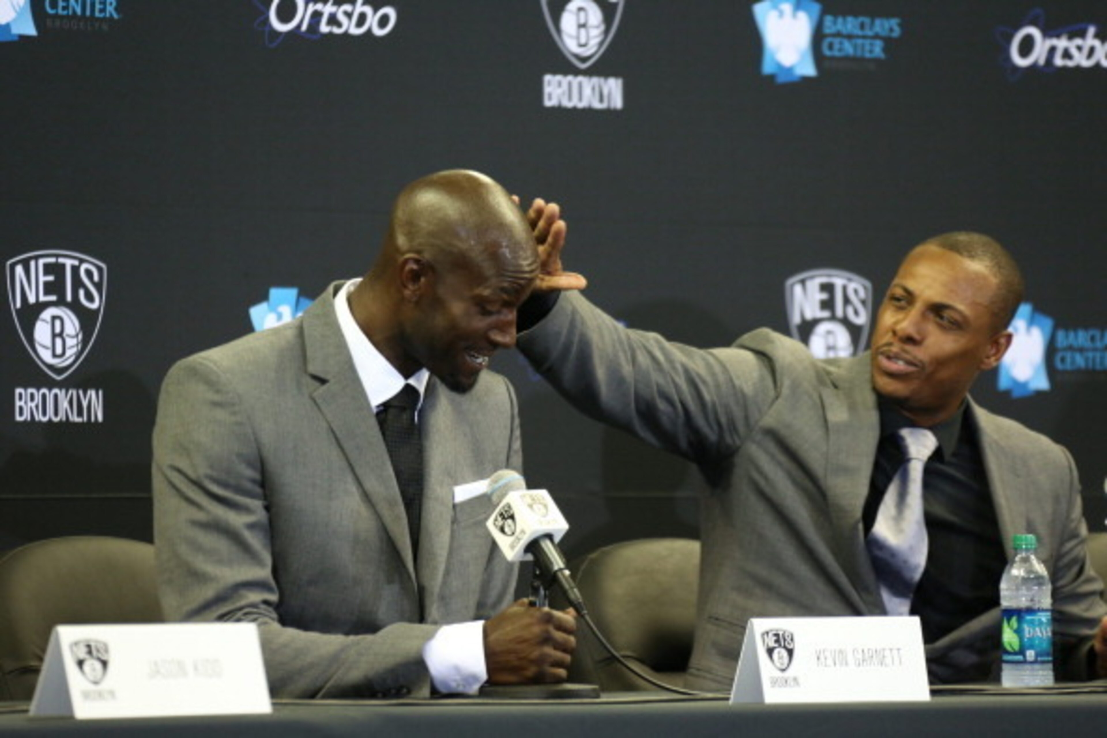 BROOKLYN, NY - July 18: Paul Pierce #34 and Kevin Garnett #2 of the Brooklyn Nets interact during a press conference at the Barclays Center on July 18, 2013 in the Brooklyn borough of New York City.  NOTE TO USER: User expressly acknowledges and agrees th