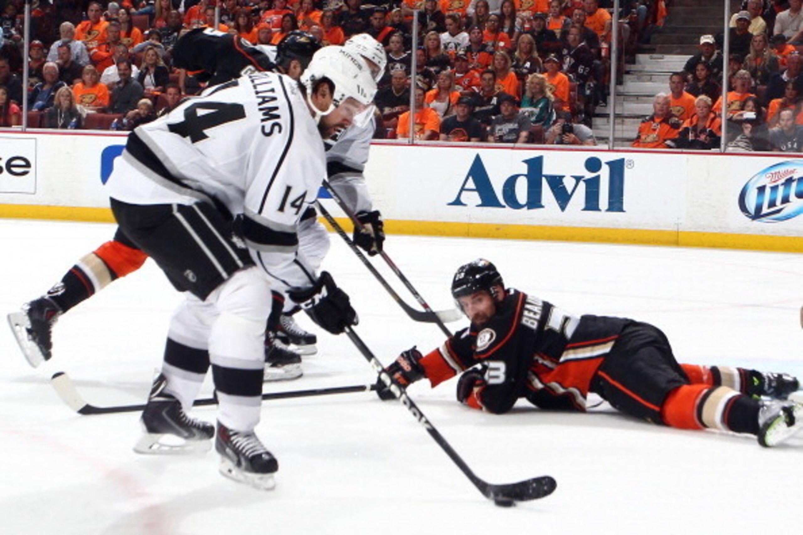 ANAHEIM, CA - MAY 3:  Justin Williams #14 of the Los Angeles Kings handles the puck as Francois Beauchemin #23 of the Anaheim Ducks looks on in Game One of the Second Round of the 2014 Stanley Cup Playoffs at Honda Center on May 3, 2014 in Anaheim, Califo