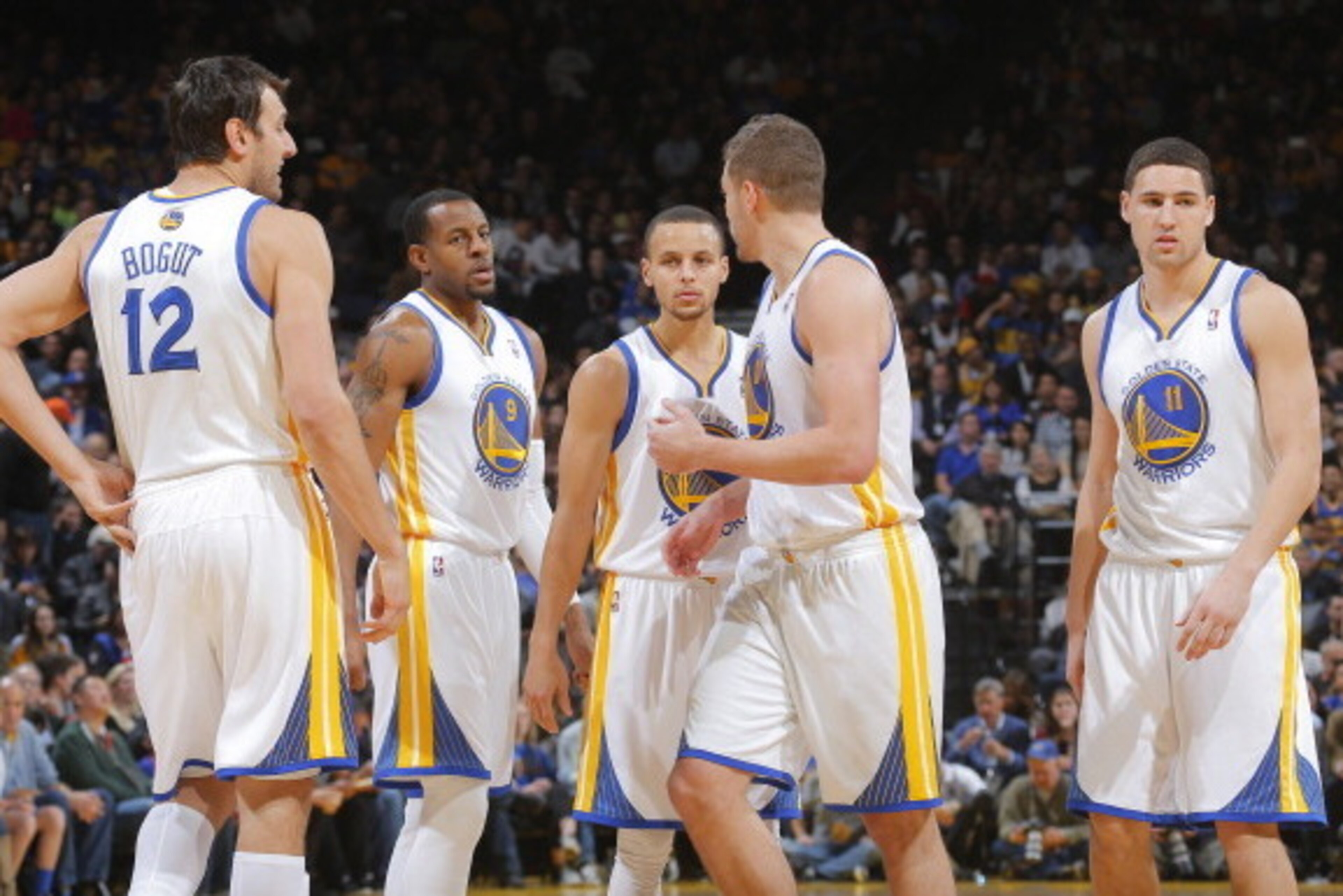 OAKLAND, CA - JANUARY 20: Andrew Bogut #12, Andre Iguodala #9, Stephen Curry #30, David Lee #10 and Klay Thompson #11 of the Golden State Warriors in a game against the Indiana Pacers on January 20, 2014 at Oracle Arena in Oakland, California. NOTE TO USE OAKLAND, CA - JANUARY 20: Andrew Bogut #12, Andre Iguodala #9, Stephen Curry #30, David Lee #10 and Klay Thompson #11 of the Golden State Warriors in a game against the Indiana Pacers on January 20, 2014 at Oracle Arena in Oakland, California. NOTE TO USE