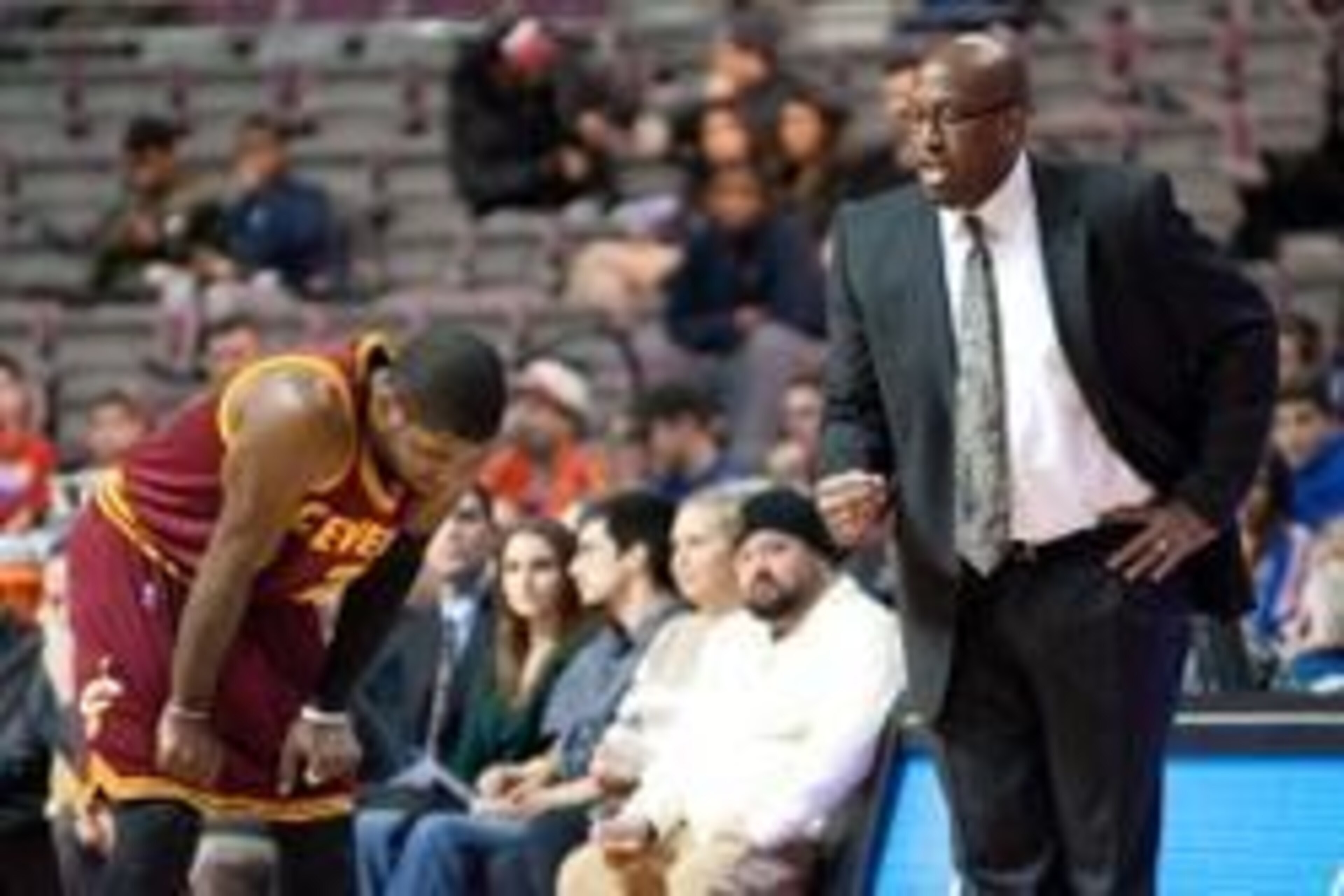 Feb 12, 2014; Auburn Hills, MI, USA; Cleveland Cavaliers head coach Mike Brown talks to point guard Kyrie Irving (2) during the first quarter against the Detroit Pistons at The Palace of Auburn Hills. Mandatory Credit: Tim Fuller-USA TODAY Sports