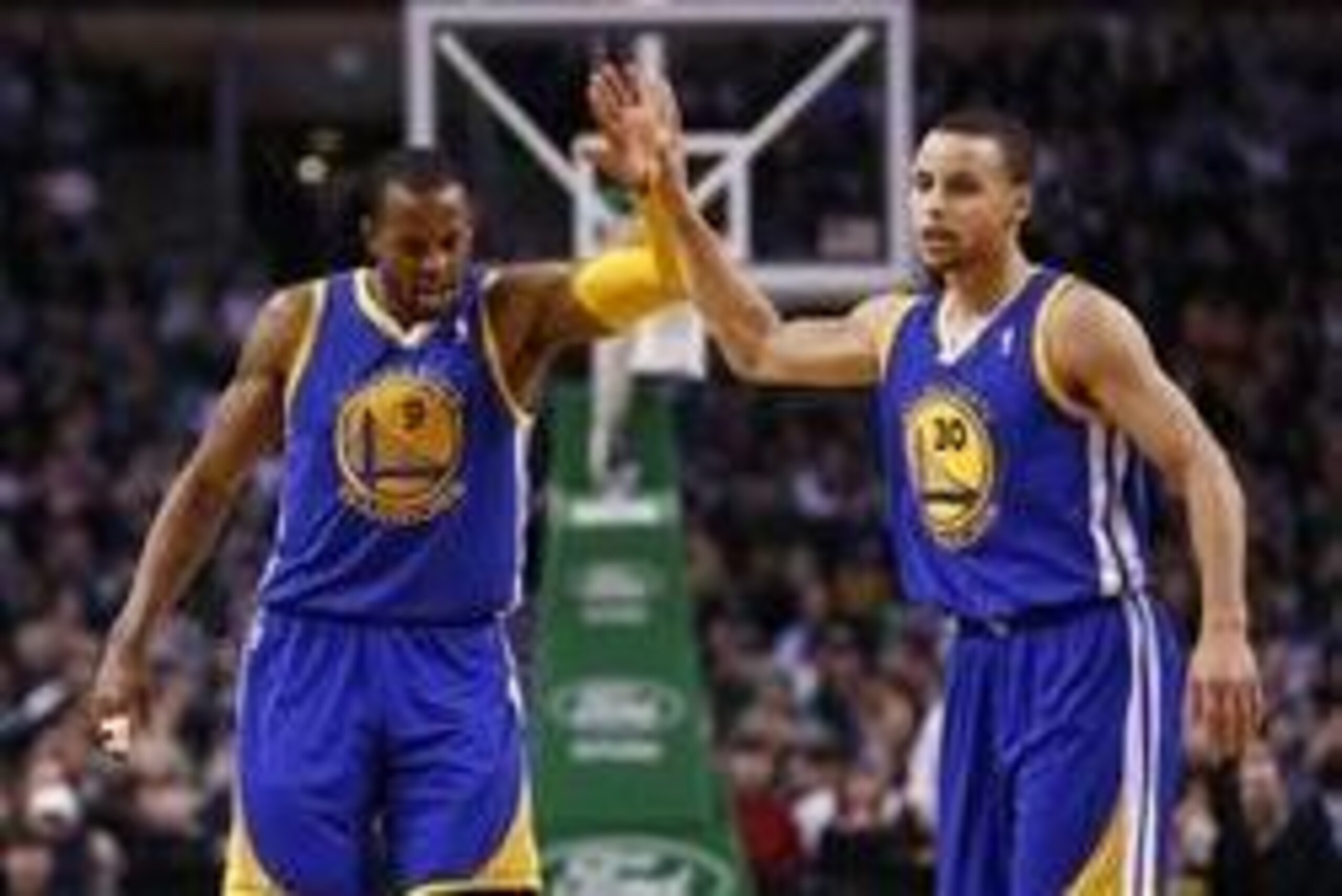 Mar 5, 2014; Boston, MA, USA; Golden State Warriors small forward Andre Iguodala (9) and point guard Stephen Curry (30) celebrate during the second half of a game against the Boston Celtics at TD Garden. Mandatory Credit: Mark L. Baer-USA TODAY Sports