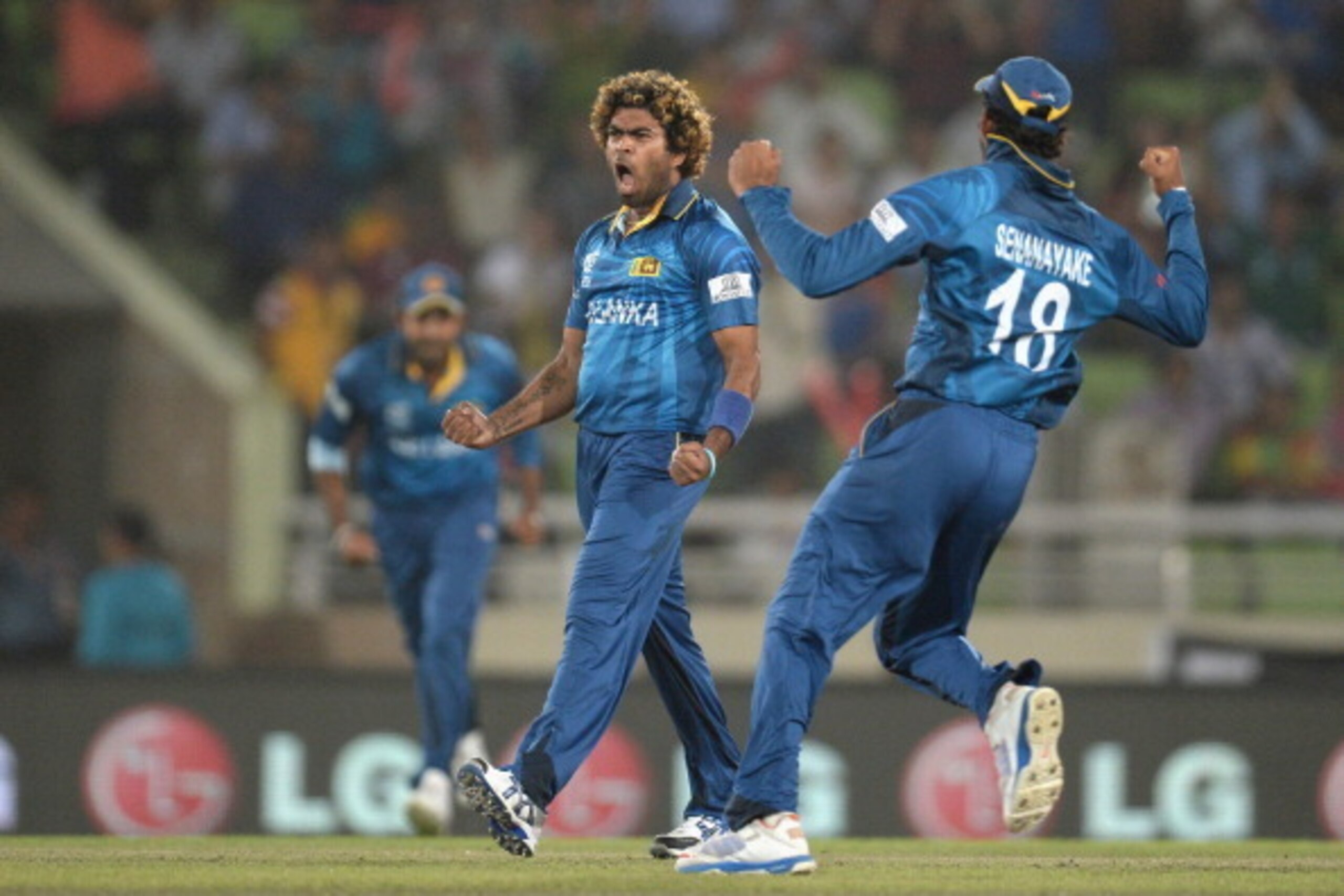 DHAKA, BANGLADESH - APRIL 03:  Lasith Malinga of Sri Lanka celebrates bowling Dwayne Smith of the West Indies during the ICC World Twenty20 Bangladesh 2014 semi final between Sri Lanka and the West Indies at Sher-e-Bangla Mirpur Stadium on April 3, 2014 i