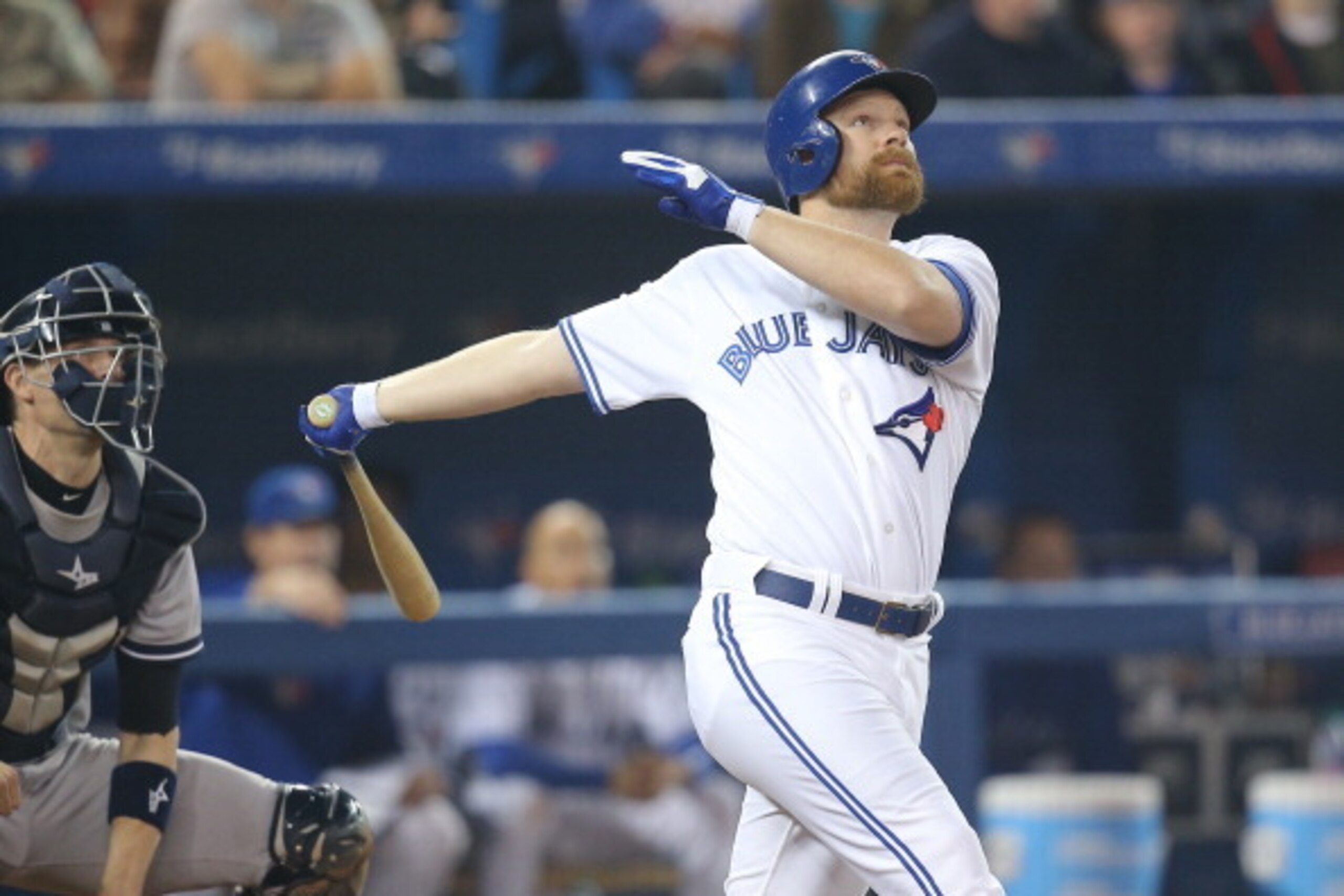 TORONTO, CANADA - SEPTEMBER 19: Adam Lind #26 of the Toronto Blue Jays hits a three-run home run in the seventh inning during MLB game action against the New York Yankees on September 19, 2013 at Rogers Centre in Toronto, Ontario, Canada. (Photo by Tom Sz