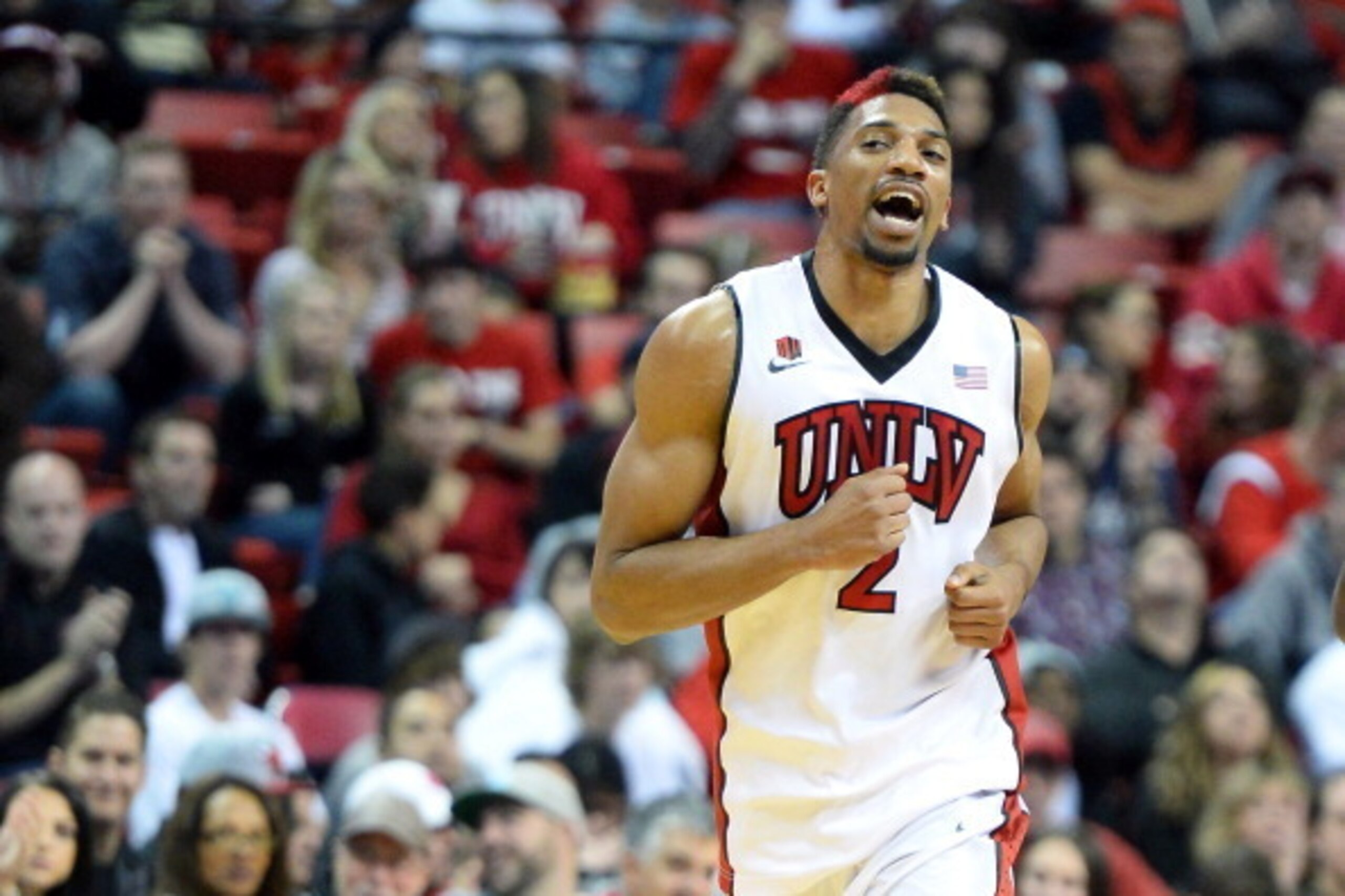 LAS VEGAS, NV - DECEMBER 28:  Khem Birch #2 of the UNLV Rebels reacts after hitting a shot against the California State Fullerton Titans during their game at the Thomas & Mack Center on December 28, 2013 in Las Vegas, Nevada. UNLV won 83-64.  (Photo by Et