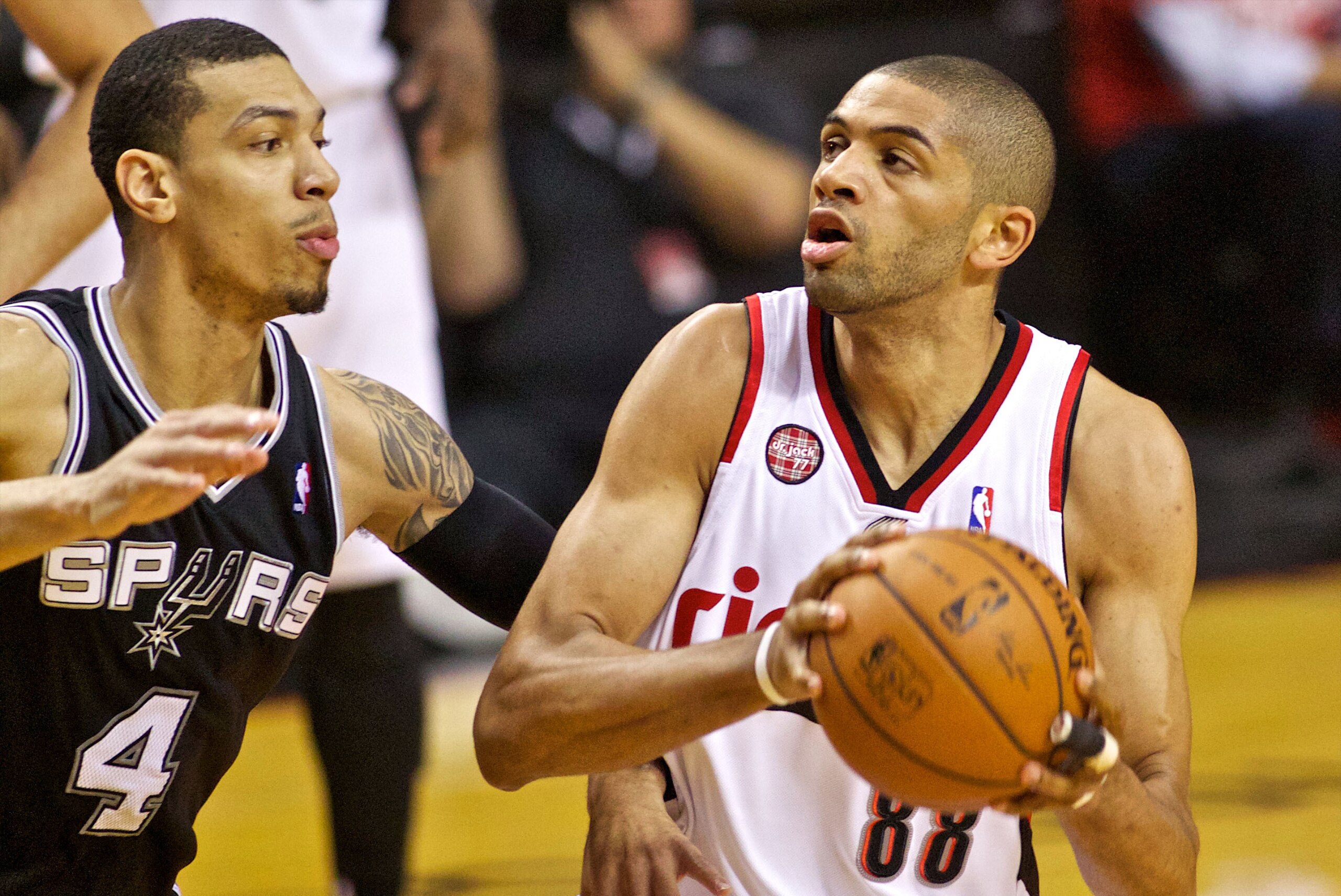 May 12, 2014; Portland, OR, USA; Portland Trail Blazers forward Nicolas Batum (88) drives past San Antonio Spurs guard Danny Green (4) during the first quarter in game four of the second round of the 2014 NBA Playoffs at the Moda Center. Mandatory Credit: