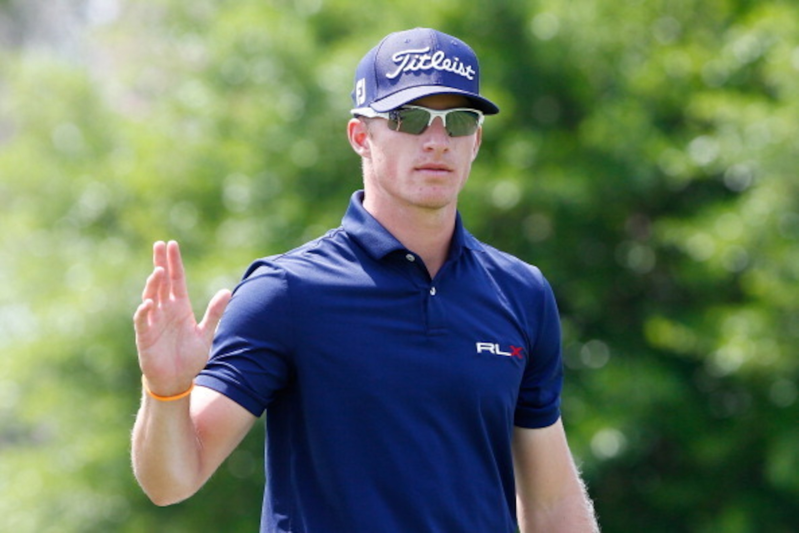 ORLANDO, FL - MARCH 22:  Morgan Hoffmann of the United States waves before hitting his tee shot on the first hole during the third round of the Arnold Palmer Invitational presented by MasterCard at the Bay Hilll Club and Lodge on March 22, 2014 in Orlando