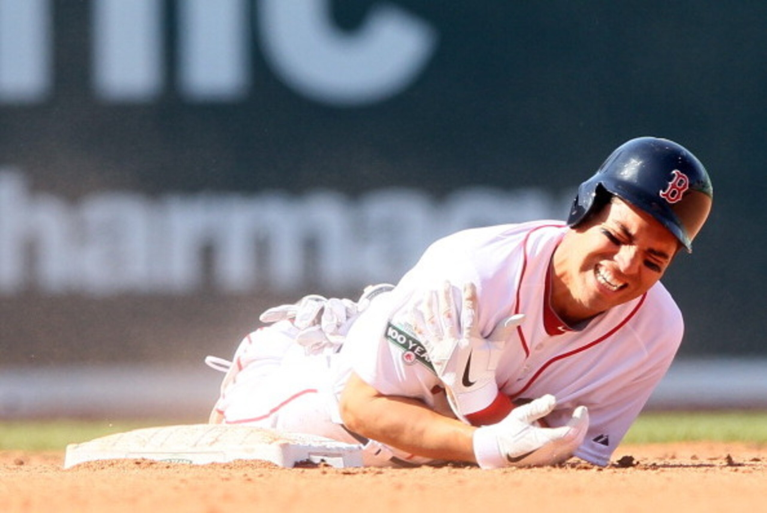 BOSTON, MA - APRIL 13:  Jacoby Ellsbury #2 of the Boston Red Sox reacts after he was injured in a double play in the bottom of the fourth inning against the Tampa Bay Rays during the home opener on April 13, 2012 at Fenway Park in Boston, Massachusetts.  