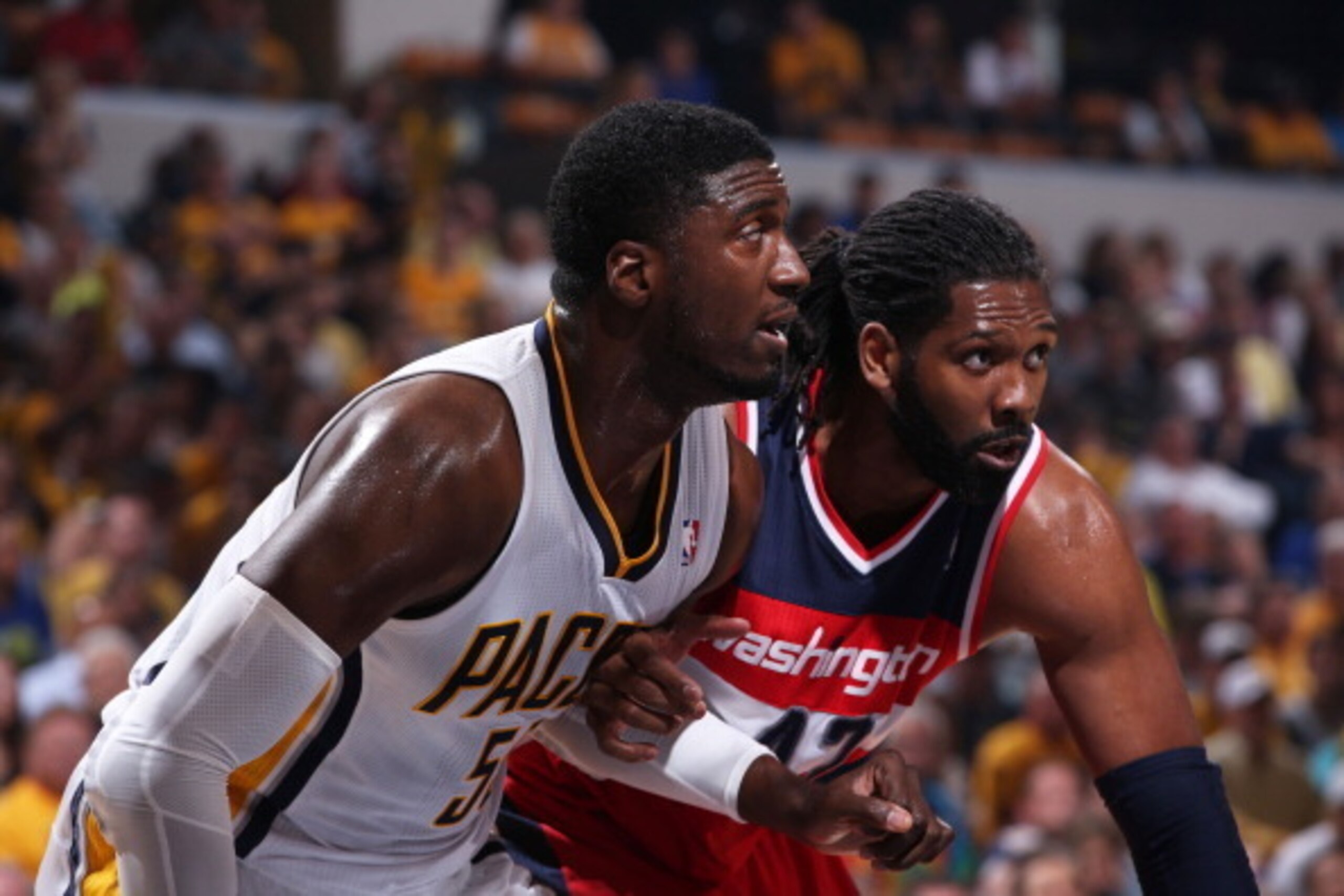 Indianapolis, Indiana - MAY 13:  Roy Hibbert #55 of the Indiana Pacers and Nene #42 of the Washington Wizards during  Game Five of the Eastern Conference Semifinals in the 2014 NBA Playoffs on May 13, 2014 at Bankers Life Fieldhouse in Indianapolis, India