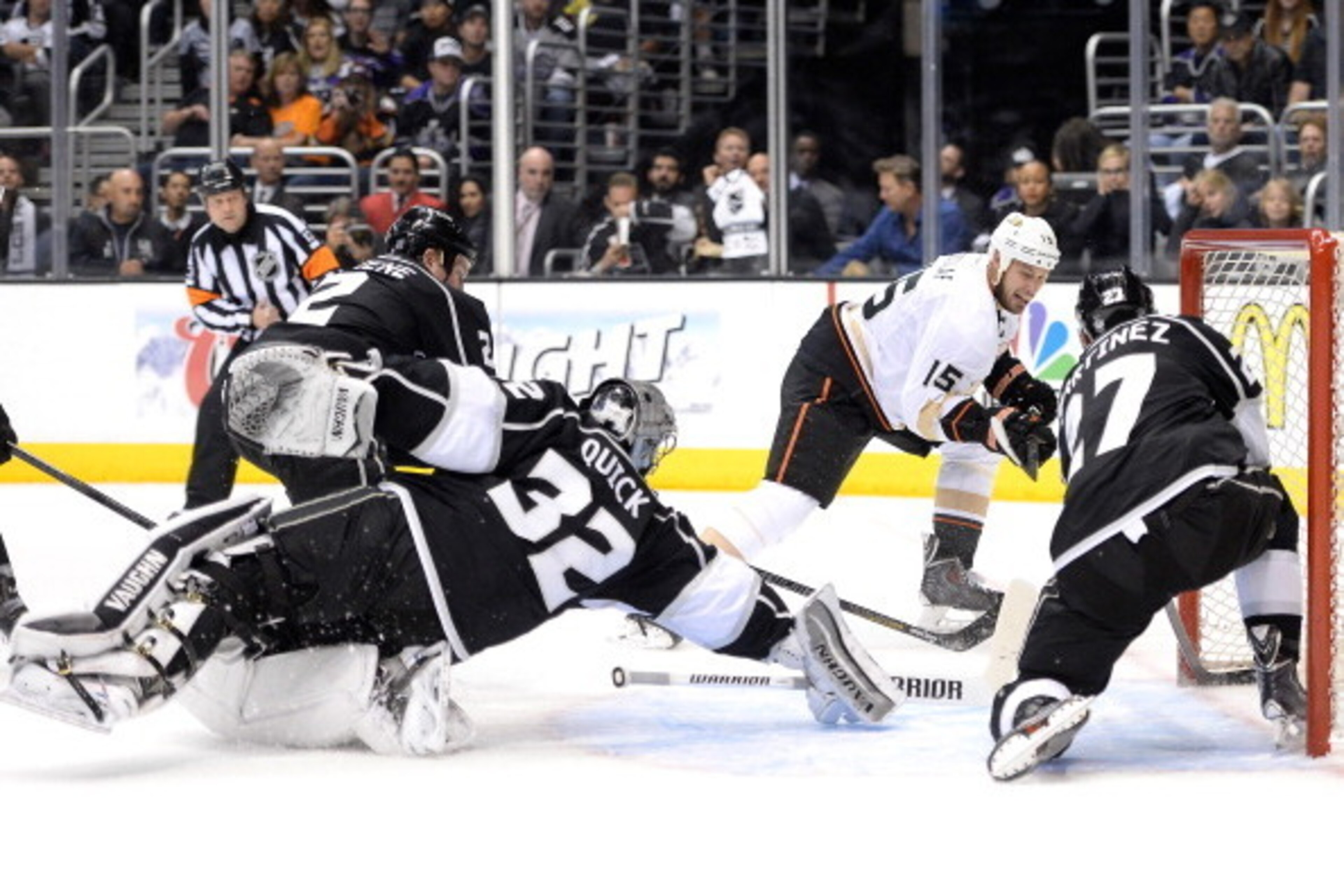 LOS ANGELES, CA - MAY 10:  Ryan Getzlaf #15 of the Anaheim Ducks scores a goal past Jonathan Quick #32 and Alec Martinez #27 of the Los Angeles Kings during the first period in Game Four of the Second Round of the 2014 NHL Stanley Cup Playoffs at Staples 