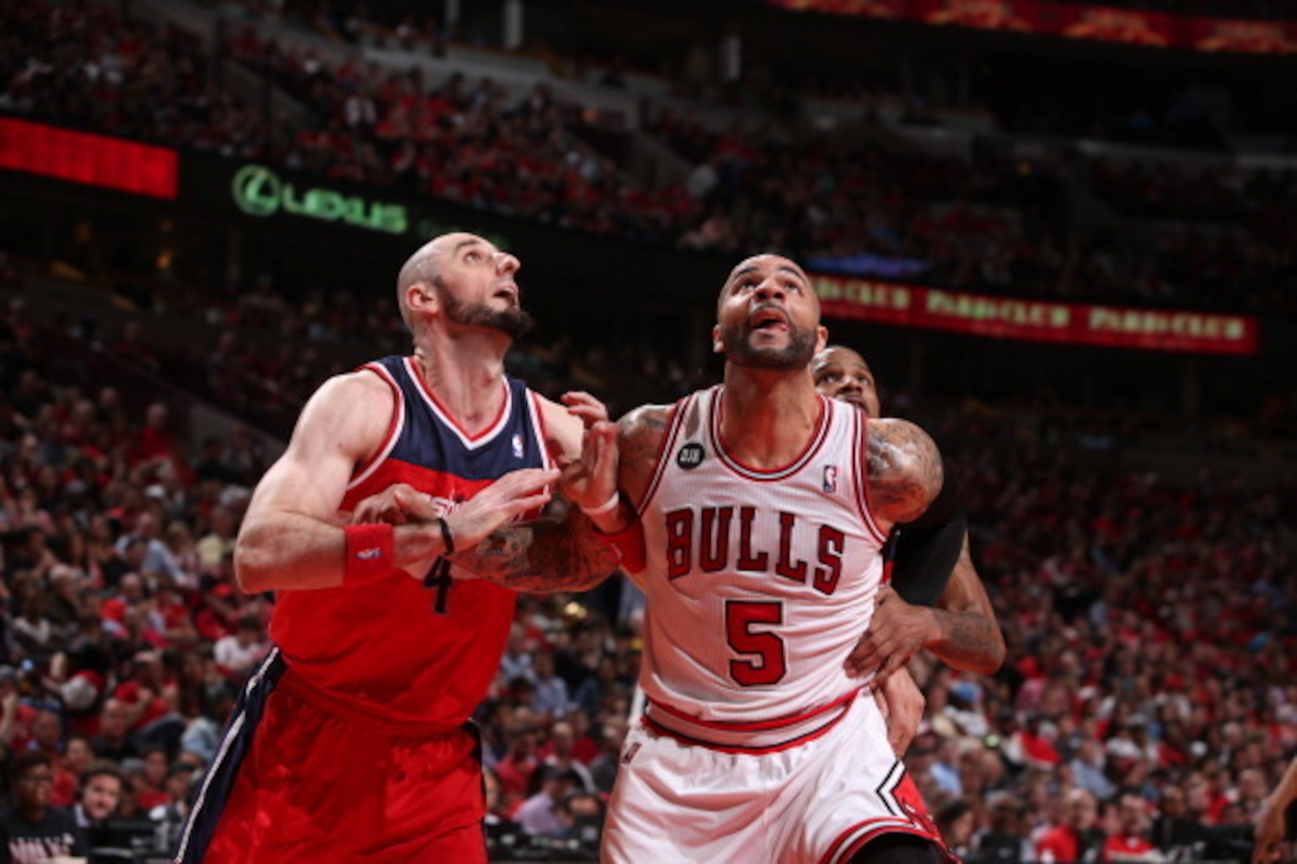 CHICAGO, IL - APRIL: Marcin Gortat #4 of the Washington Wizards battles for position against Carlos Boozer #5 of the Chicago Bulls during Game 1 of the Eastern Conference Quarterfinals on April 20, 2014 at the United Center in Chicago, Illinois. NOTE TO U
