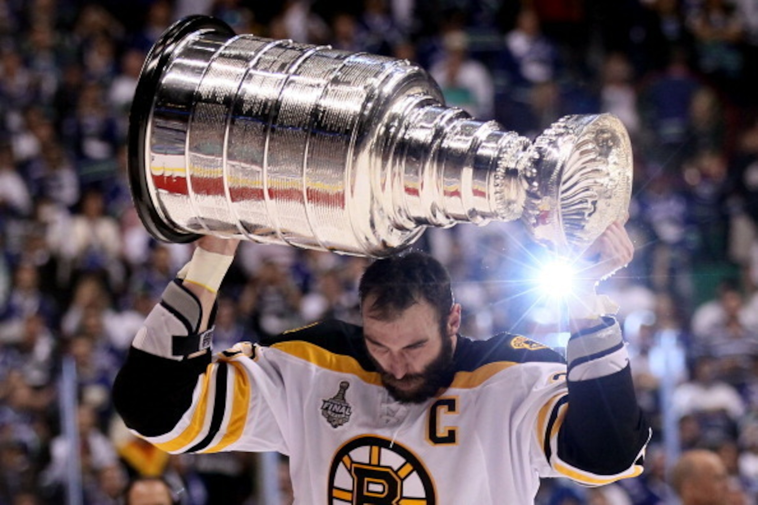VANCOUVER, BC - JUNE 15:  Zdeno Chara #33 of the Boston Bruins celebrates with the Stanley Cup after defeating the Vancouver Canucks in Game Seven of the 2011 NHL Stanley Cup Final at Rogers Arena on June 15, 2011 in Vancouver, British Columbia, Canada. T