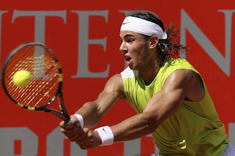 ROME - MAY 14:  Rafael Nadal of Spain plays a backhand against Roger Federer of Switzerland in the final , during the ATP Masters Series at the Foro Italico, May 14, 2006 in Rome, Italy. (Photo by Clive Brunskill/Getty Images)