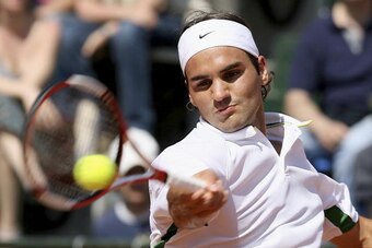 ROME - MAY 14:  Roger Federer of Switzerland plays a forehand against Rafael Nadal of Spain in the final , during the ATP Masters Series at the Foro Italico, May 14, 2006 in Rome, Italy. (Photo by Clive Brunskill/Getty Images)