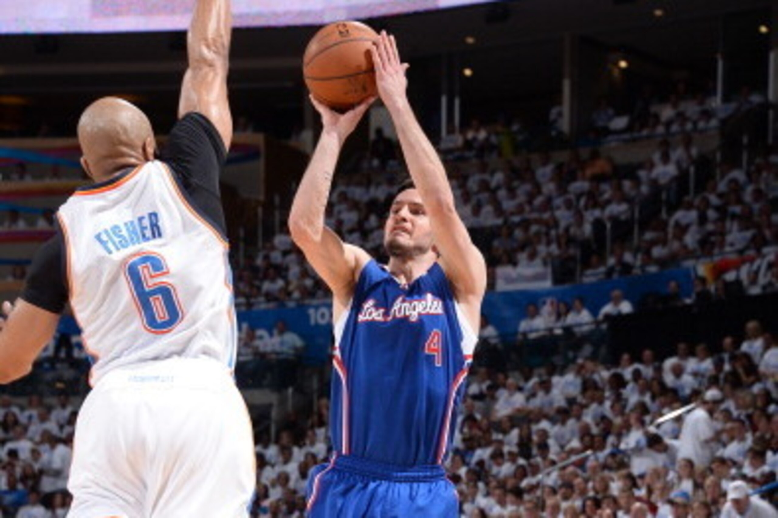 OKLAHOMA CITY, OK - May 13, 2014: J.J. Redick #4 of the Los Angeles Clippers shoots the ball against the Oklahoma City Thunder in Game 5 of the Western Conference Semifinals during the 2014 NBA Playoffs at the Chesapeake Arena on May 13, 2014 in Oklahoma 