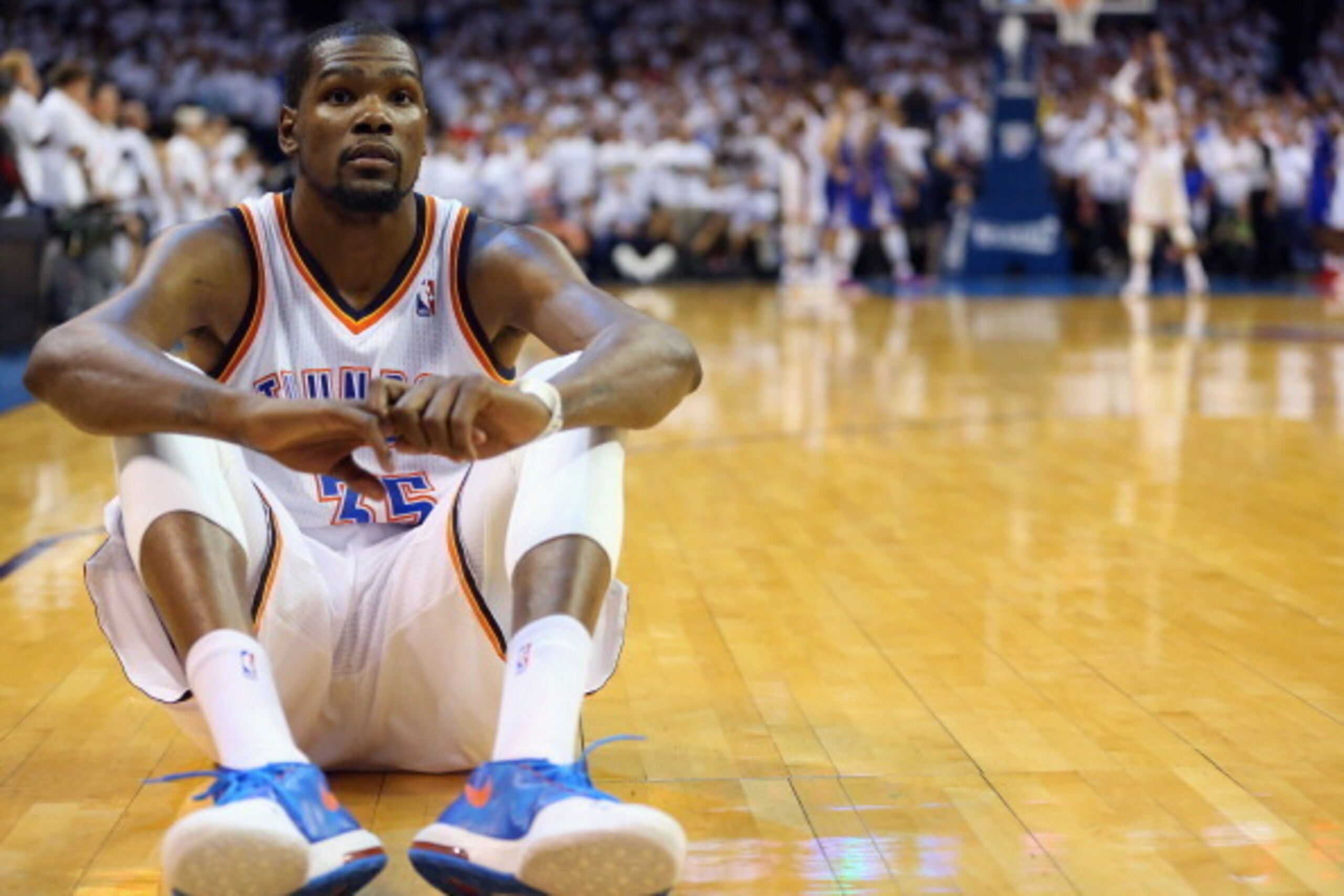 OKLAHOMA CITY, OK - MAY 13:  Kevin Durant #35 of the Oklahoma City Thunder sits on the court as Russell Westbrook makes three free throws against the Los Angeles Clippers to take the lead in Game Five of the Western Conference Semifinals during the 2014 N