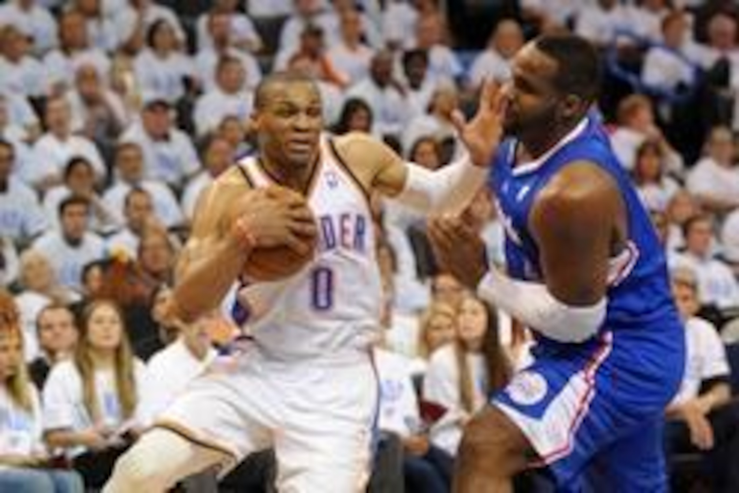 May 13, 2014; Oklahoma City, OK, USA; Oklahoma City Thunder guard Russell Westbrook (0) handles the ball against Los Angeles Clippers forward Glen Davis (0) during the fourth quarter in game five of the second round of the 2014 NBA Playoffs at Chesapeake 