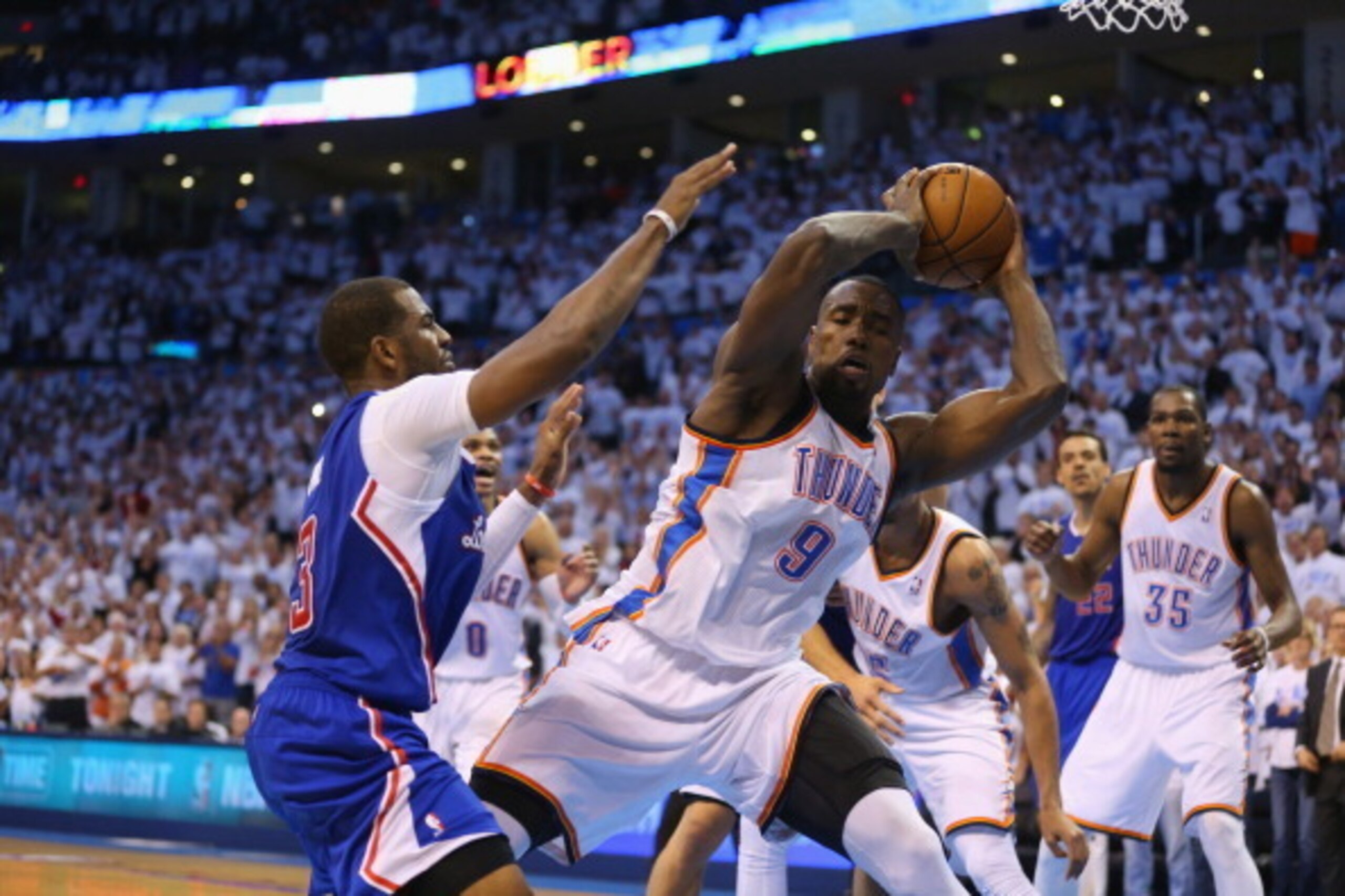 OKLAHOMA CITY, OK - MAY 13:  Chris Paul #3 of the Los Angeles Clippers loses possesion of the ball to Serge Ibaka #9 of the Oklahoma City Thunder in the final seconds in Game Five of the Western Conference Semifinals during the 2014 NBA Playoffs at Chesap