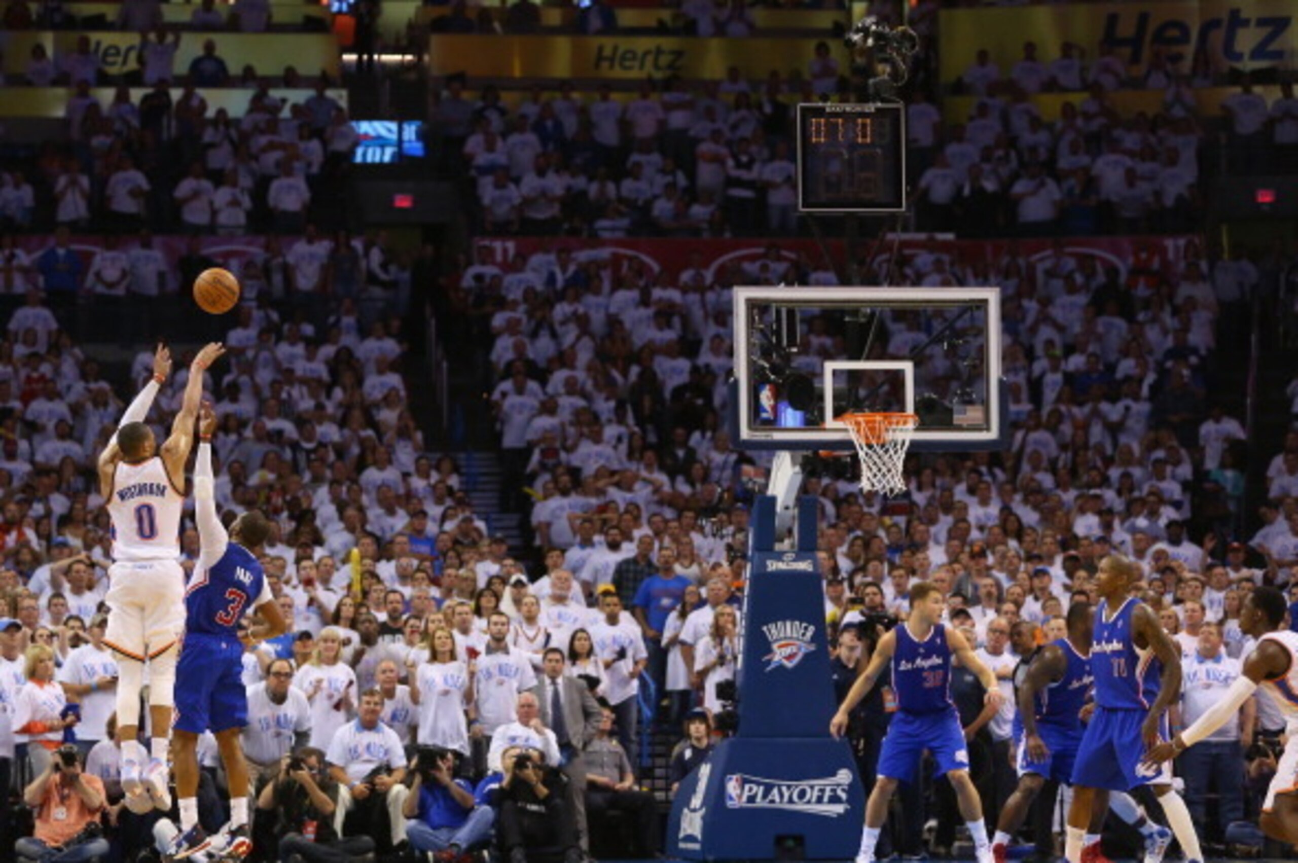 OKLAHOMA CITY, OK - MAY 13: Russell Westbrook #0 of the Oklahoma City Thunder is fouled on a three-point attempt by Chris Paul #3 of the Los Angeles Clippers in Game Five of the Western Conference Semifinals during the 2014 NBA Playoffs at Chesapeake Ene OKLAHOMA CITY, OK - MAY 13: Russell Westbrook #0 of the Oklahoma City Thunder is fouled on a three-point attempt by Chris Paul #3 of the Los Angeles Clippers in Game Five of the Western Conference Semifinals during the 2014 NBA Playoffs at Chesapeake Ene