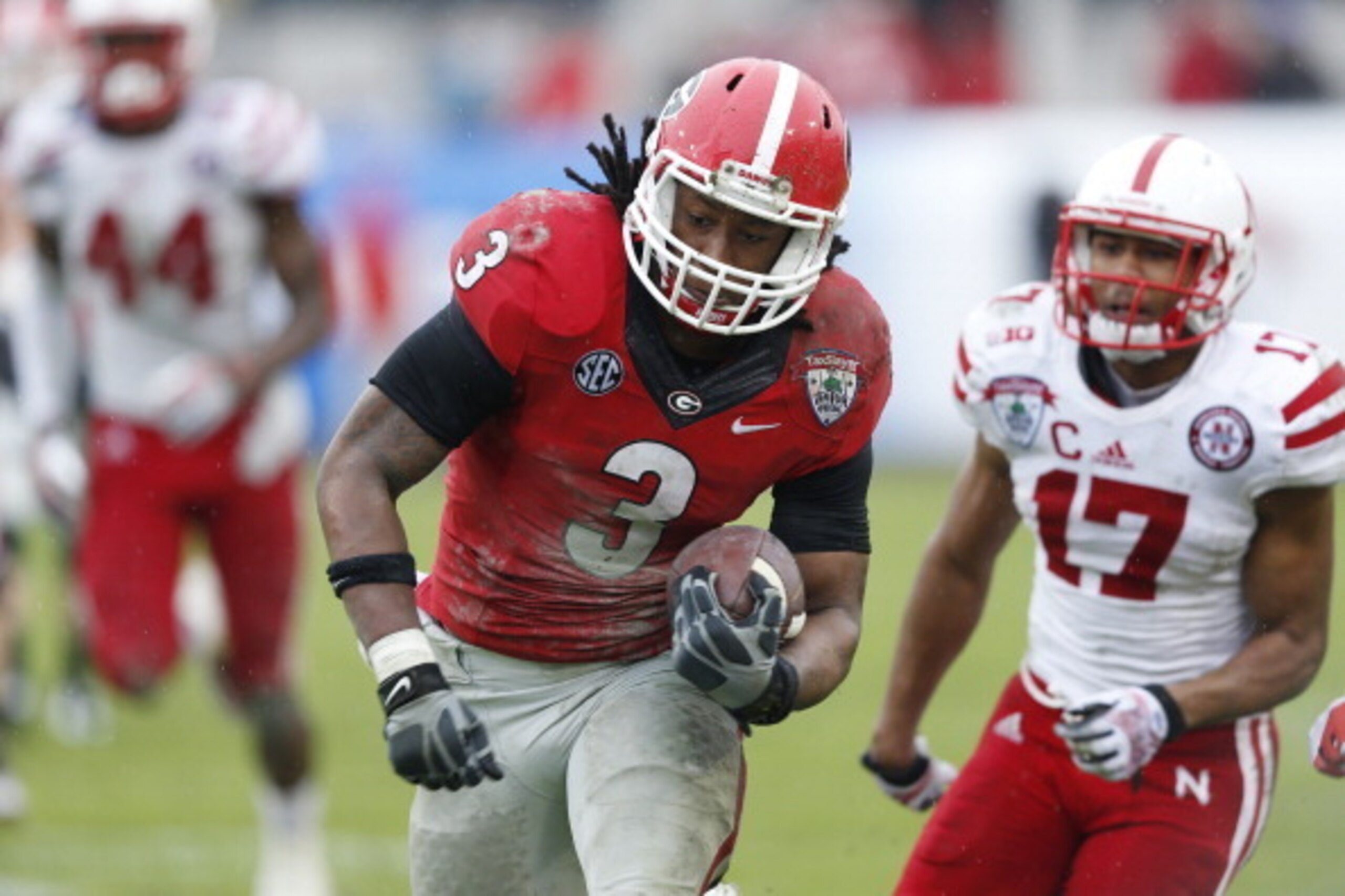 JACKSONVILLE, FL - JANUARY 1: Todd Gurley #3 of the Georgia Bulldogs runs downfield on a 30-yard pass play to set up a field goal in the second half against the Nebraska Cornhuskers during the TaxSlayer.com Gator Bowl at Everbank Field on January 1, 2014 