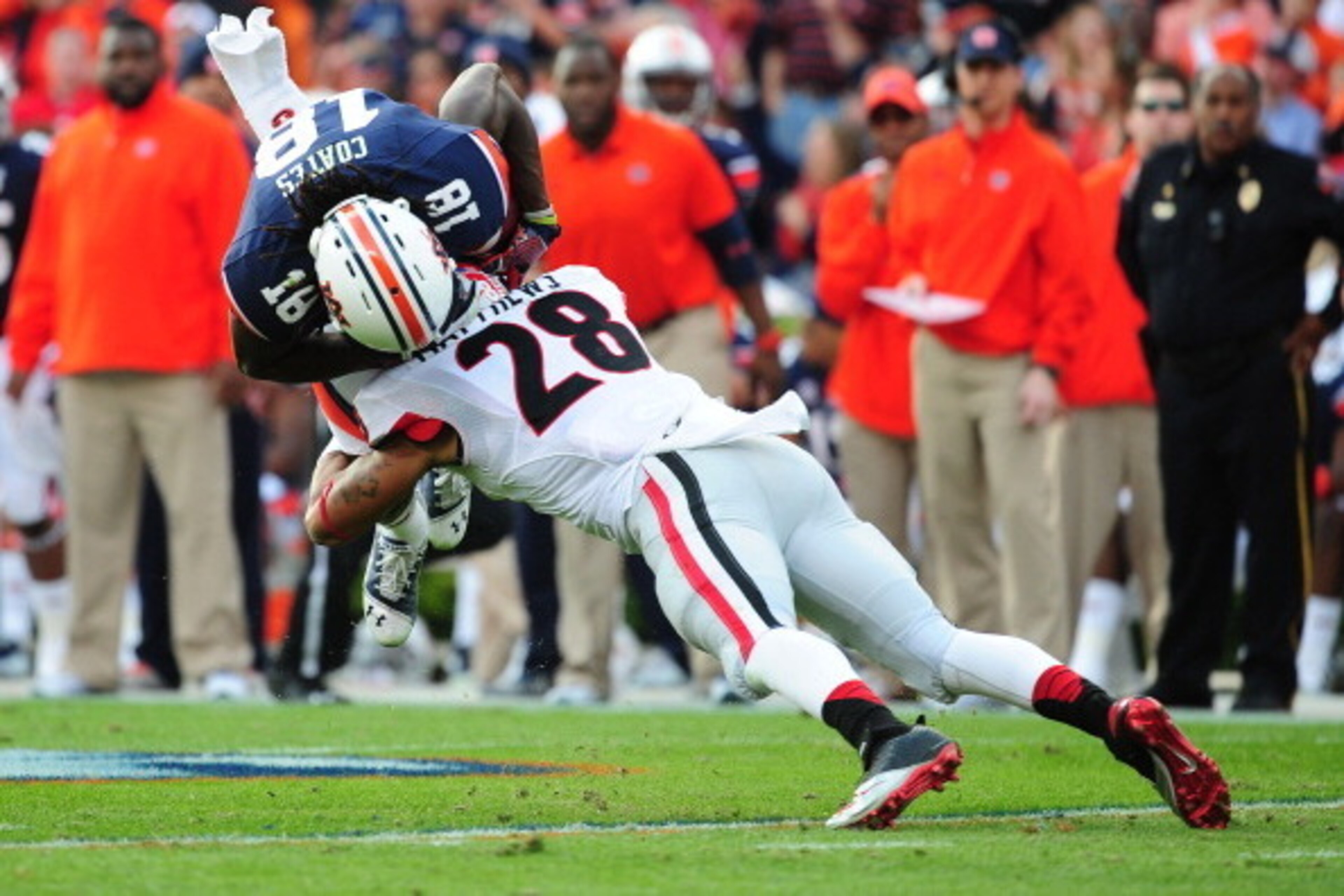 AUBURN, AL - NOVEMBER 16: Sammie Coates #18 of the Auburn Tigers is tackled by Tray Matthews #28 of the Georgia Bulldogs at Jordan-Hare Stadium on November 16, 2013 in Auburn Alabama. (Photo by Scott Cunningham/Getty Images) AUBURN, AL - NOVEMBER 16: Sammie Coates #18 of the Auburn Tigers is tackled by Tray Matthews #28 of the Georgia Bulldogs at Jordan-Hare Stadium on November 16, 2013 in Auburn Alabama. (Photo by Scott Cunningham/Getty Images)