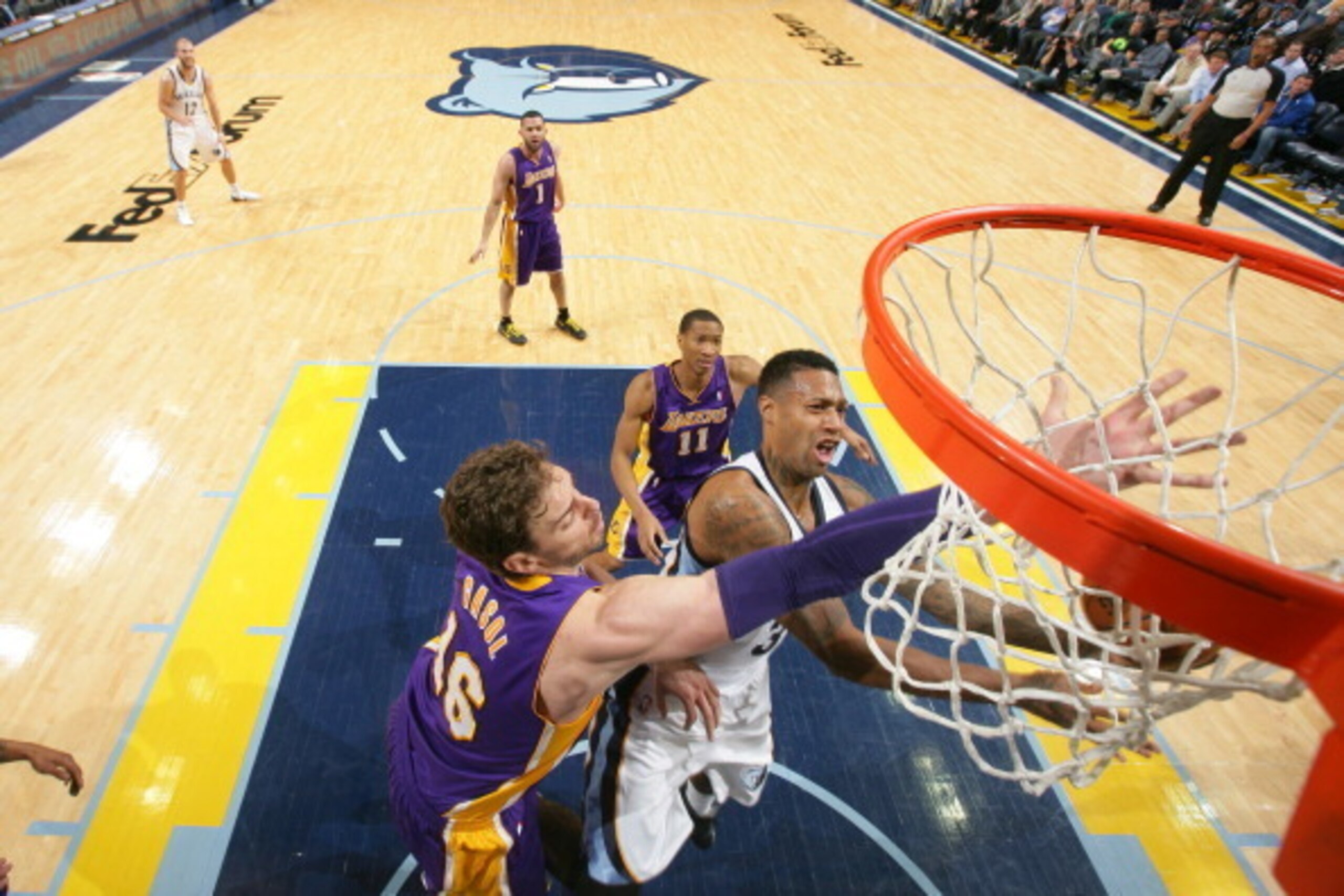 MEMPHIS, TN - FEBRUARY 26: Pau Gasol #16 of the Los Angeles Lakers blocks a shot against James Johnson #3 of the Memphis Grizzlies on February 26, 2014 at FedExForum in Memphis, Tennessee. NOTE TO USER: User expressly acknowledges and agrees that, by down