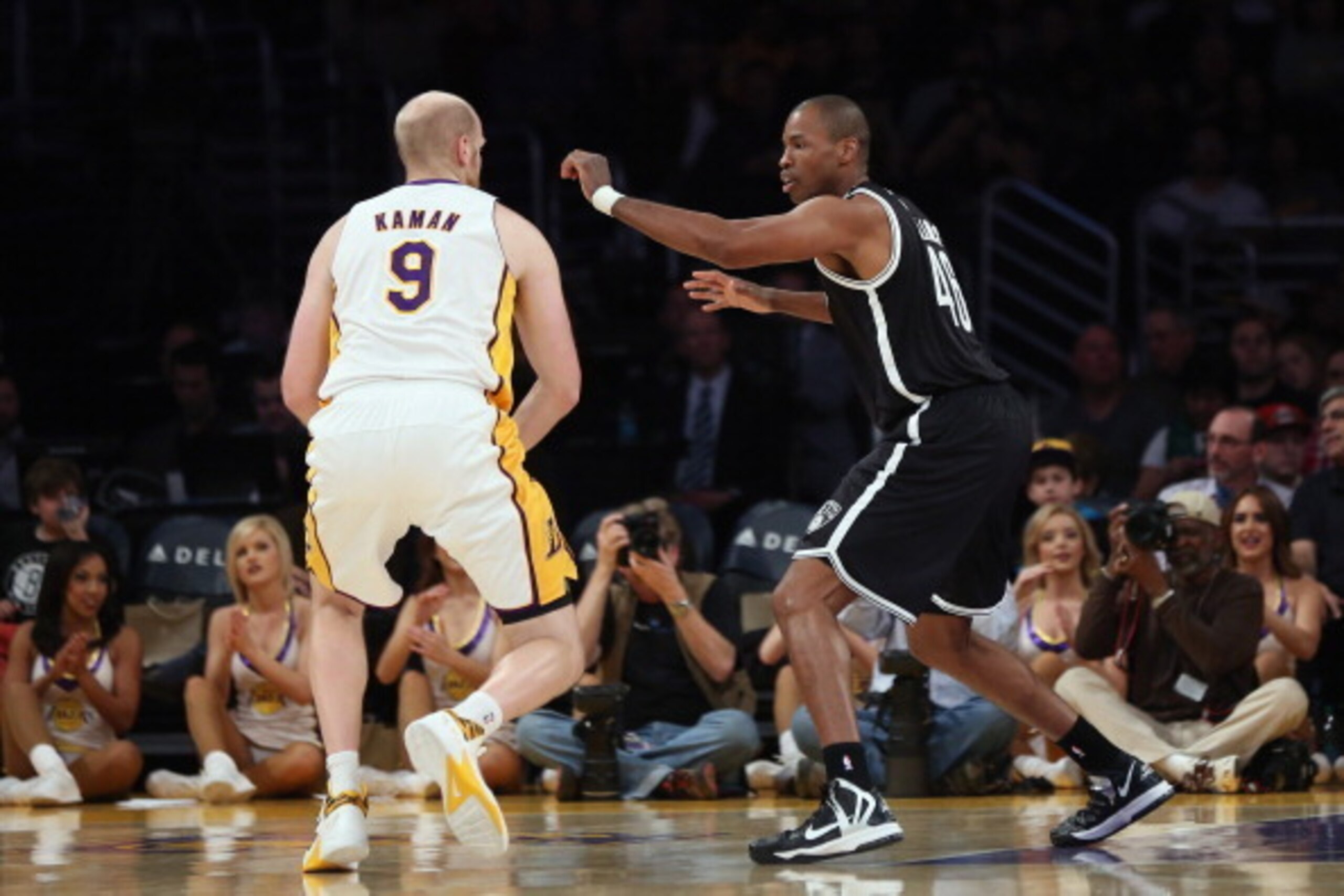 LOS ANGELES, CA - FEBRUARY 23:  Jason Collins (R) #98 of the Brooklyn Nets defends Chris Kaman #9 of the Los Angeles Lakers in the first half at Staples Center on February 23, 2014 in Los Angeles, California. NOTE TO USER: User expressly acknowledges and 