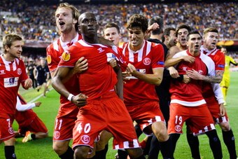 VALENCIA, SPAIN - MAY 01:  Stephane Mbia (3rdL) of Sevilla FC celebrates after scoring his team's first goal during the UEFA Europa League Semi Final second leg match between Valencia CF and Sevilla FC at Estadi de Mestalla on May 1, 2014 in Valencia, Spa