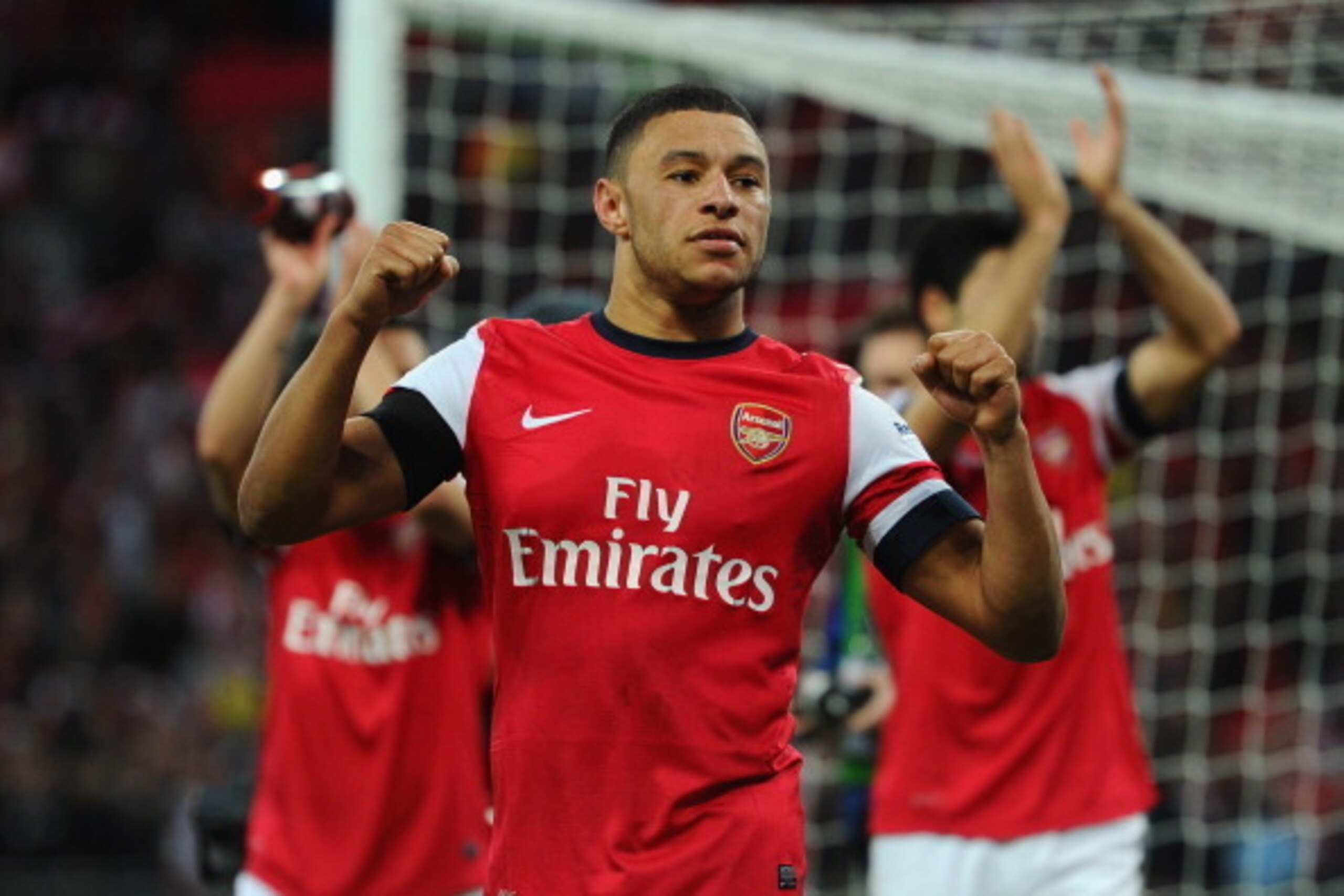 LONDON, ENGLAND - APRIL 12:  Alex Oxlade-Chamberlain of Arsenal celebrates victory during the FA Cup Semi-Final match between Wigan Athletic and Arsenal at Wembley Stadium on April 12, 2014 in London, England.  (Photo by Mike Hewitt/Getty Images)